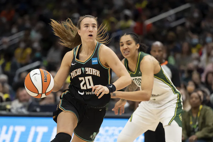 New York Liberty guard Sabrina Ionescu (20) dribbles past Seattle Storm forward Gabby Williams as we offer our best Storm vs. Liberty prediction and expert pick for Thursday's WNBA matchup at Barclays Center in Brooklyn, New York.
