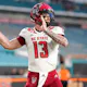 Devin Leary of the NC State Wolfpack throws a pass during pregame warm ups prior to the game against the Miami Hurricanes at Hard Rock Stadium.