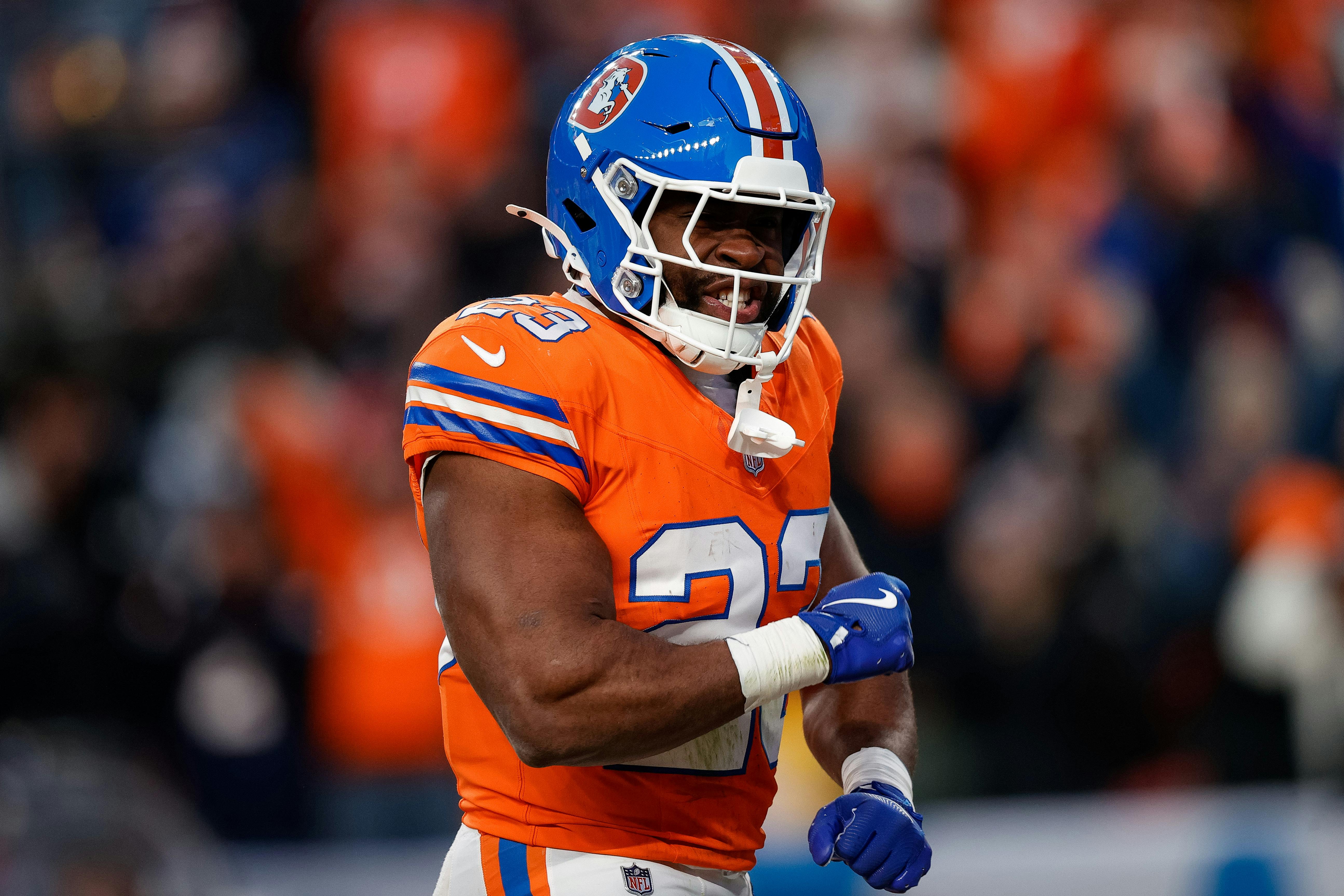 Denver Broncos running back Audric Estime (23) celebrates after a touchdown as we look at our Wild Card Weekend best bets.