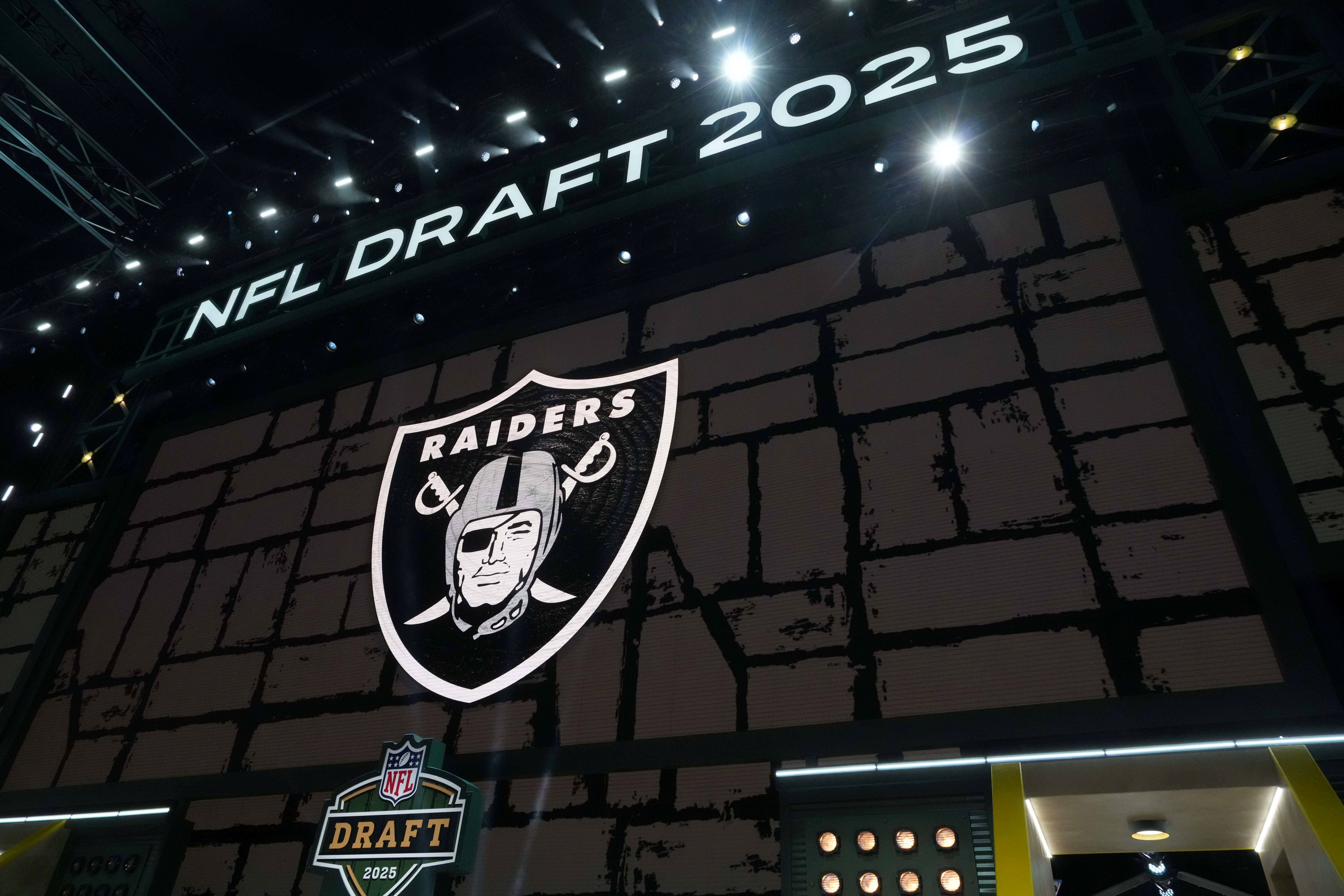 The Las Vegas Raiders logo is projected on the video board during the NFL Draft at Lambeau Field.