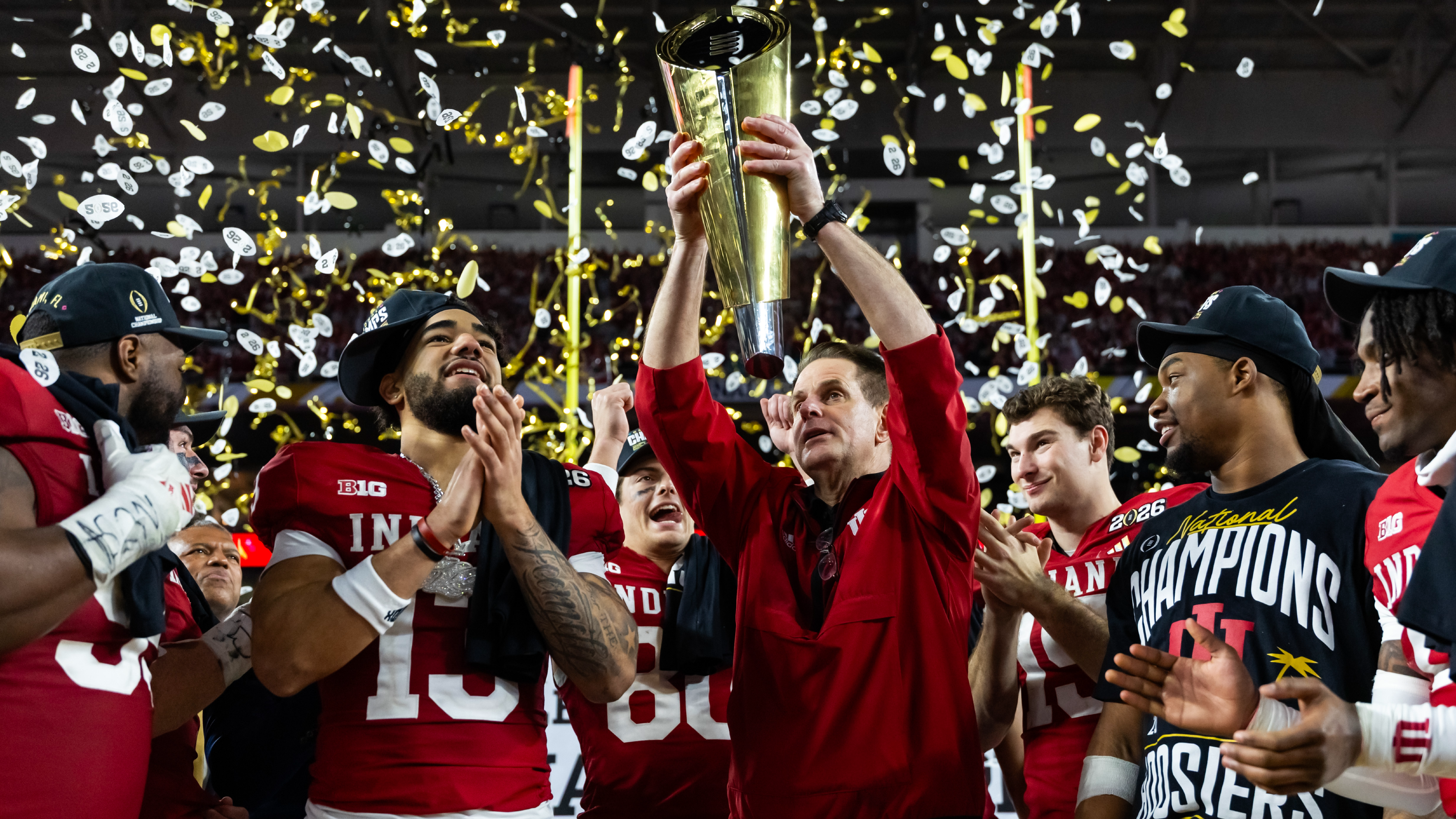 Indiana Hoosiers head coach Curt Cignetti hoists the trophy as he celebrates after defeating the Miami Hurricanes in the College Football Playoff National Championship game at Hard Rock Stadium.