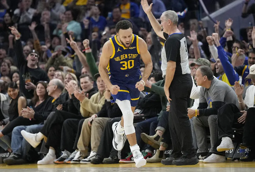 Stephen Curry #30 of the Golden State Warriors reacts after making a three-point shot as we look at our best NBA Player Props for Mavericks vs. Warriors