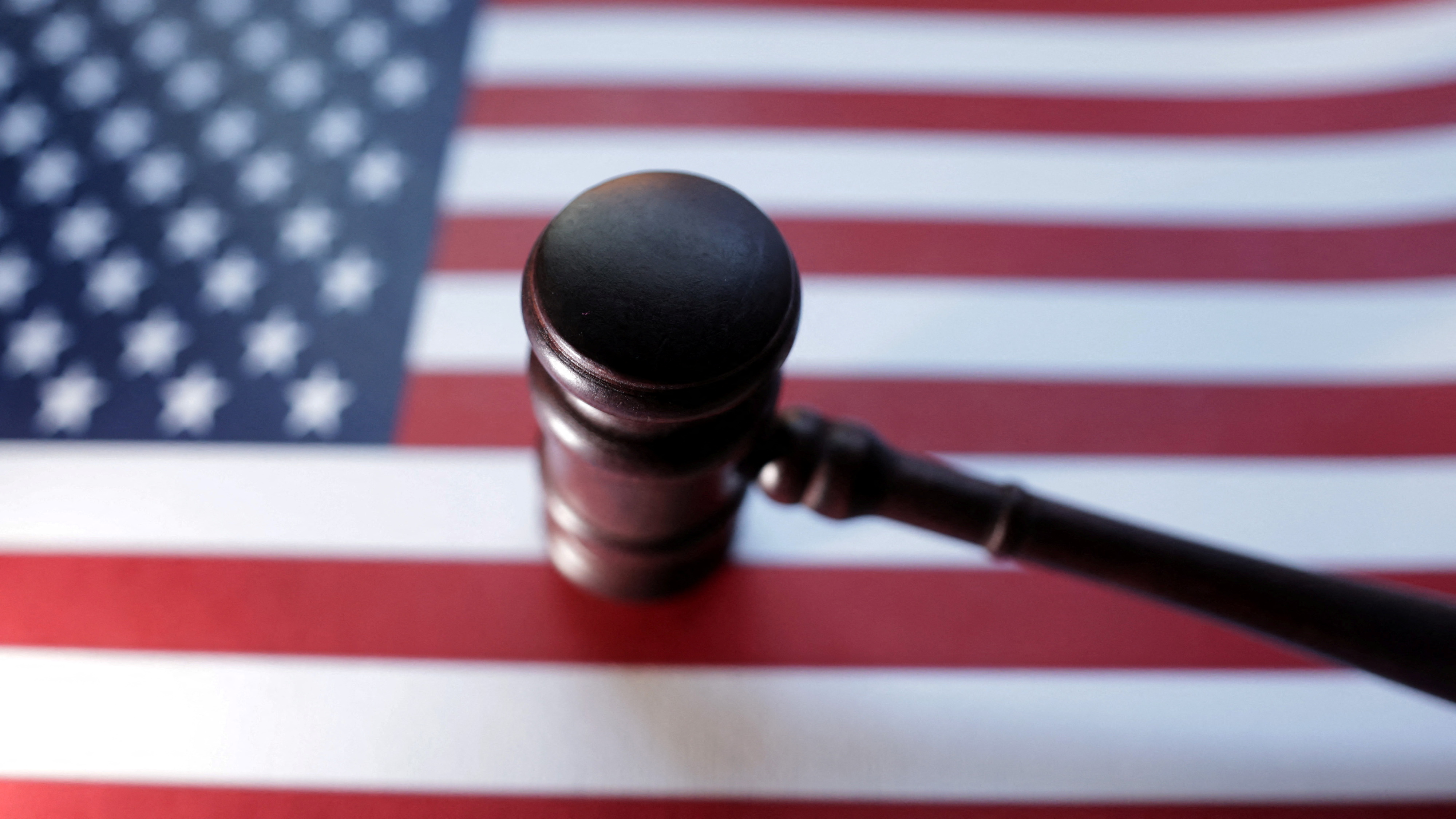 U.S. flag and Judge gavel as we look at a federal judge halting Arizona's action against Kalshi.
