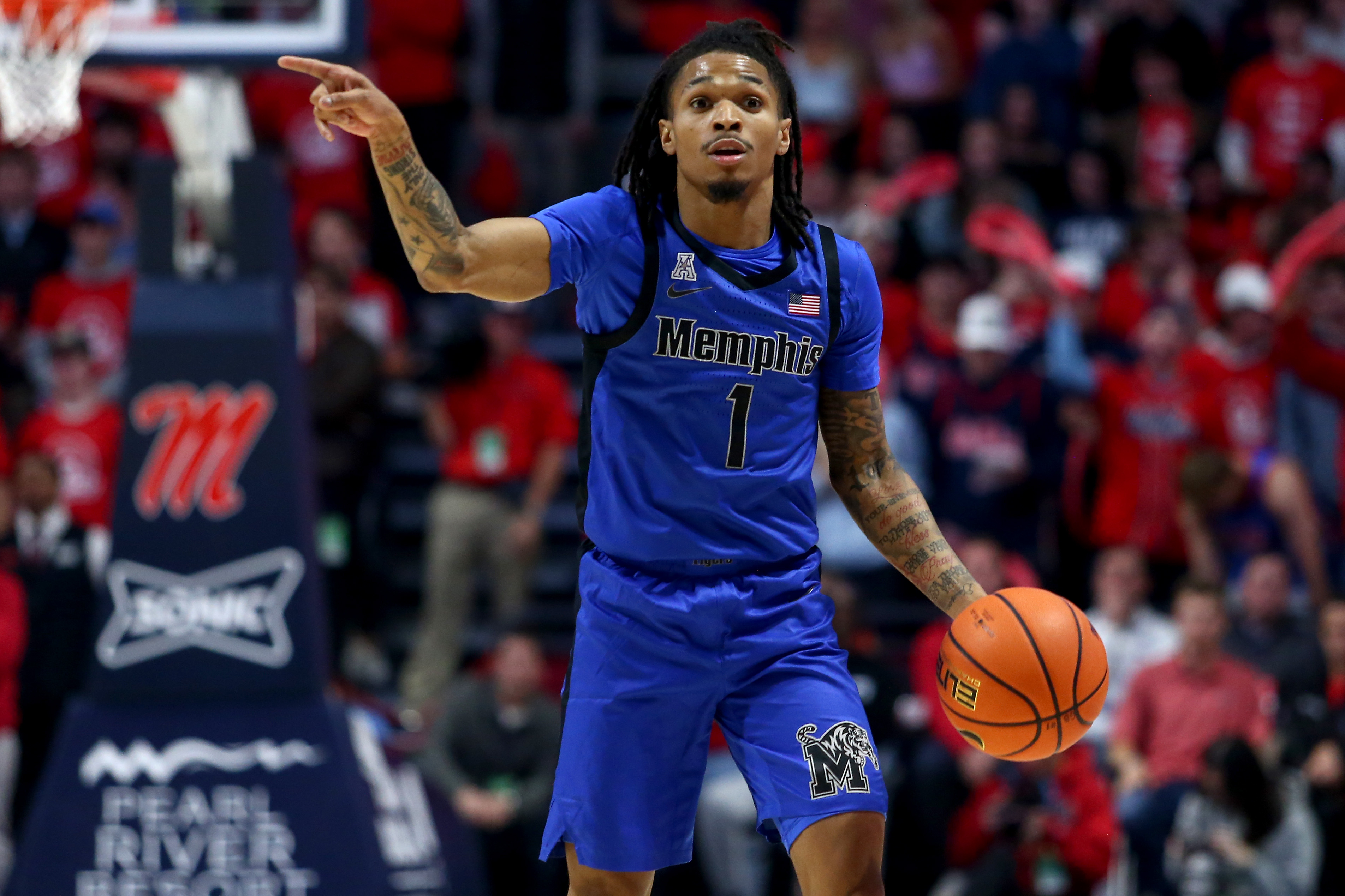 Memphis guard Dug McDaniel dribbles as we provide our UNLV vs. Memphis prediction