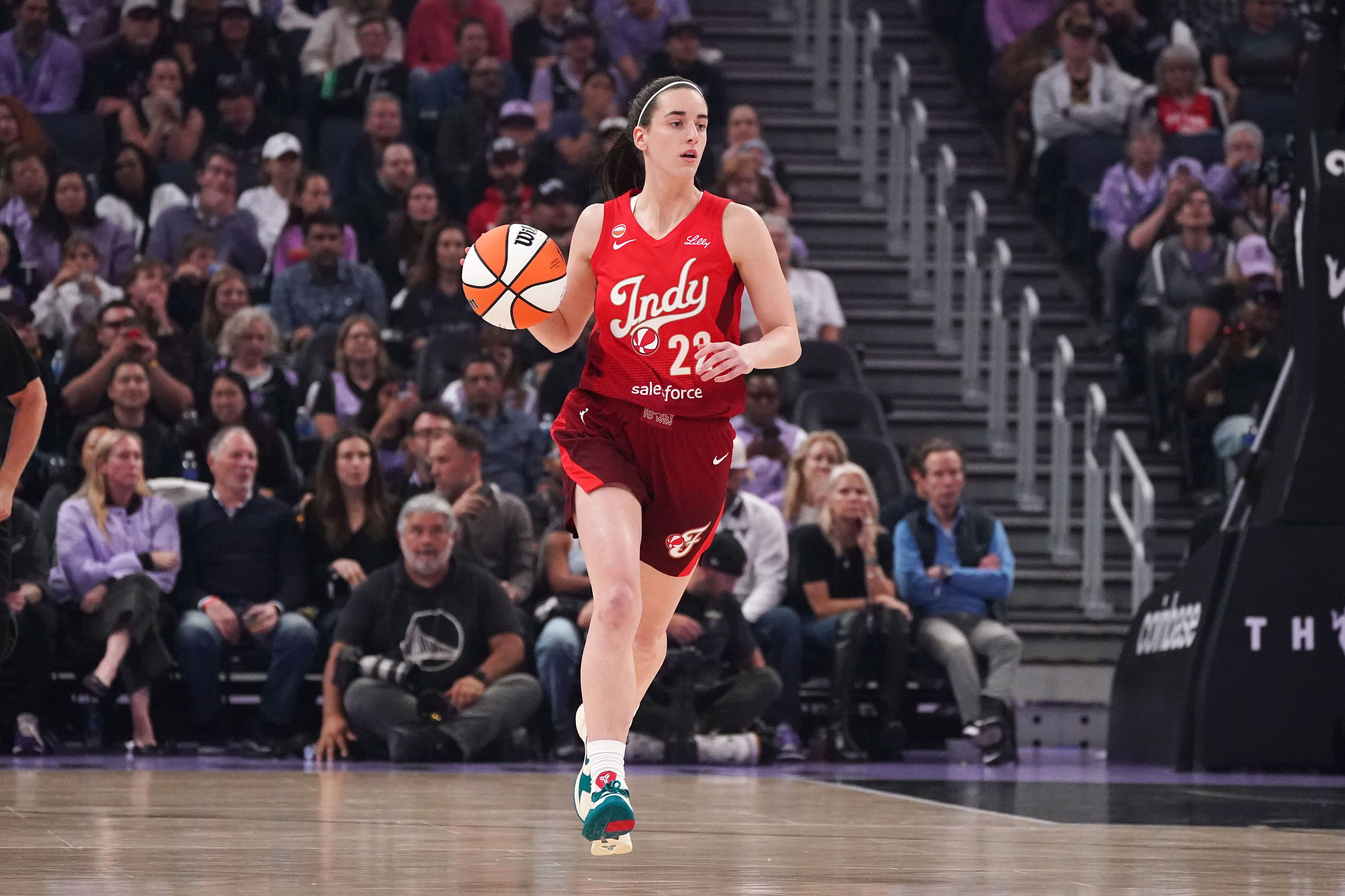 Indiana Fever guard Caitlin Clark (22) dribbles upcourt as we break down our Fever vs. Fire prediction.