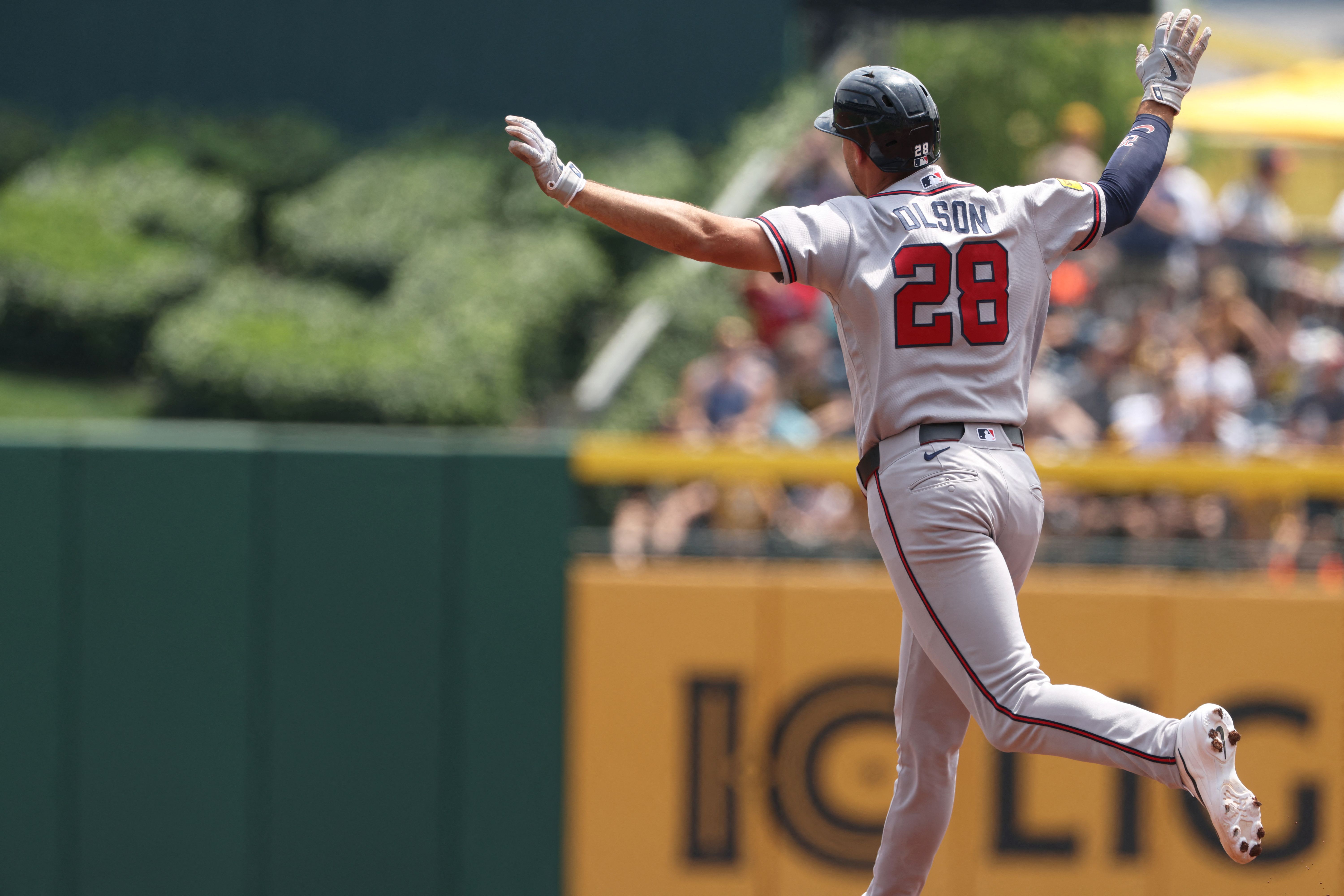 Atlanta Braves first baseman Matt Olson circles the bases as we make our best Rangers vs. Braves prediction.