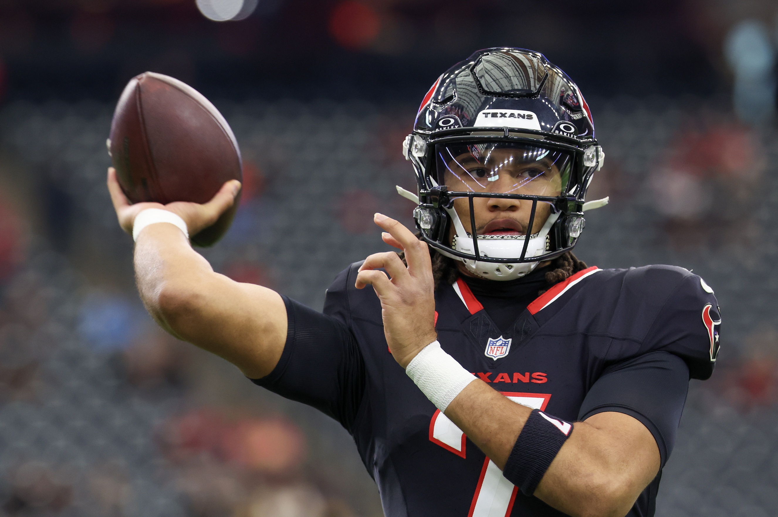 Houston Texans quarterback C.J. Stroud warms up as we look at our Texans vs. Chargers prediction.