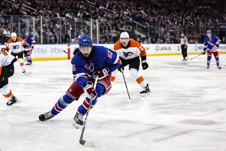 Mika Zibanejad of the New York Rangers carries the puck as we make our best Hurricanes vs. Rangers predictions