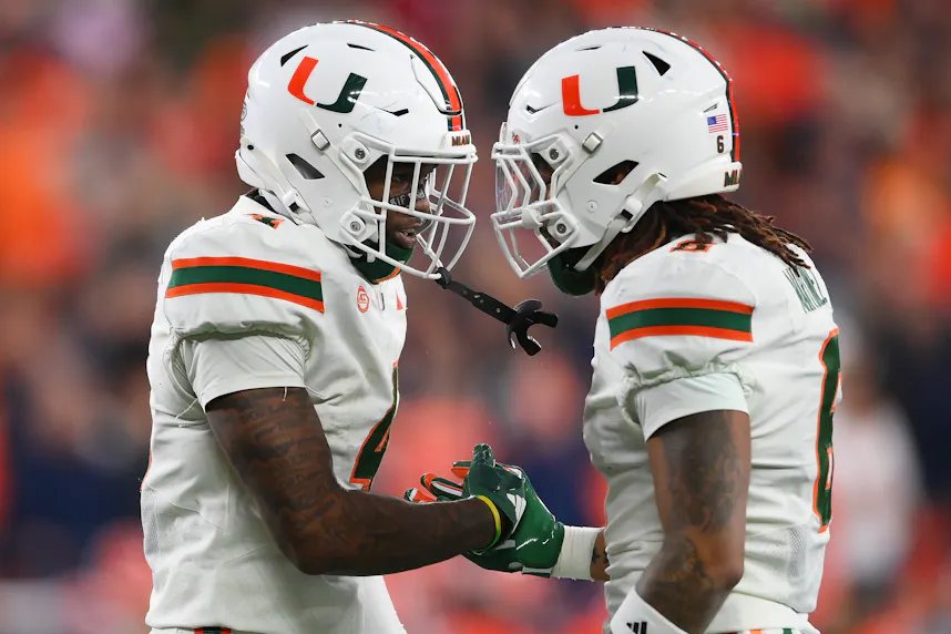 Miami Hurricanes running back Mark Fletcher Jr. celebrates with running back Damien Martinez as we make our Iowa State vs. Miami player prop picks ahead of the Pop-Tarts Bowl.
