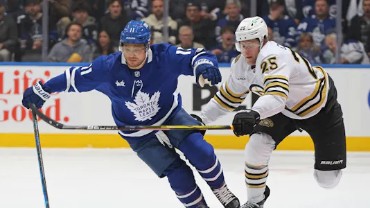 Brandon Carlo of the Boston Bruins skates to check Max Domi of the Toronto Maple Leafs in Game Three of the First Round of the 2024 Stanley Cup Playoffs. We're backing Domi in our Bruins vs. Maple Leafs predictions. 