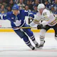 Brandon Carlo of the Boston Bruins skates to check Max Domi of the Toronto Maple Leafs in Game Three of the First Round of the 2024 Stanley Cup Playoffs. We're backing Domi in our Bruins vs. Maple Leafs predictions. 