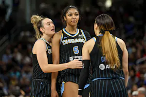 Marina Mabrey (4) holds back Angel Reese (5) as we offer our best Aces vs. Sky prediction and expert picks for Thursday's WNBA matchup at Wintrust Arena in Chicago.