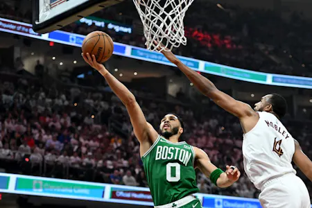 Jayson Tatum of the Boston Celtics drives to the basket against Evan Mobley of the Cleveland Cavaliers during Game 4 of the NBA playoffs. We're backing Tatum in our NBA Player Props & Expert Picks. 