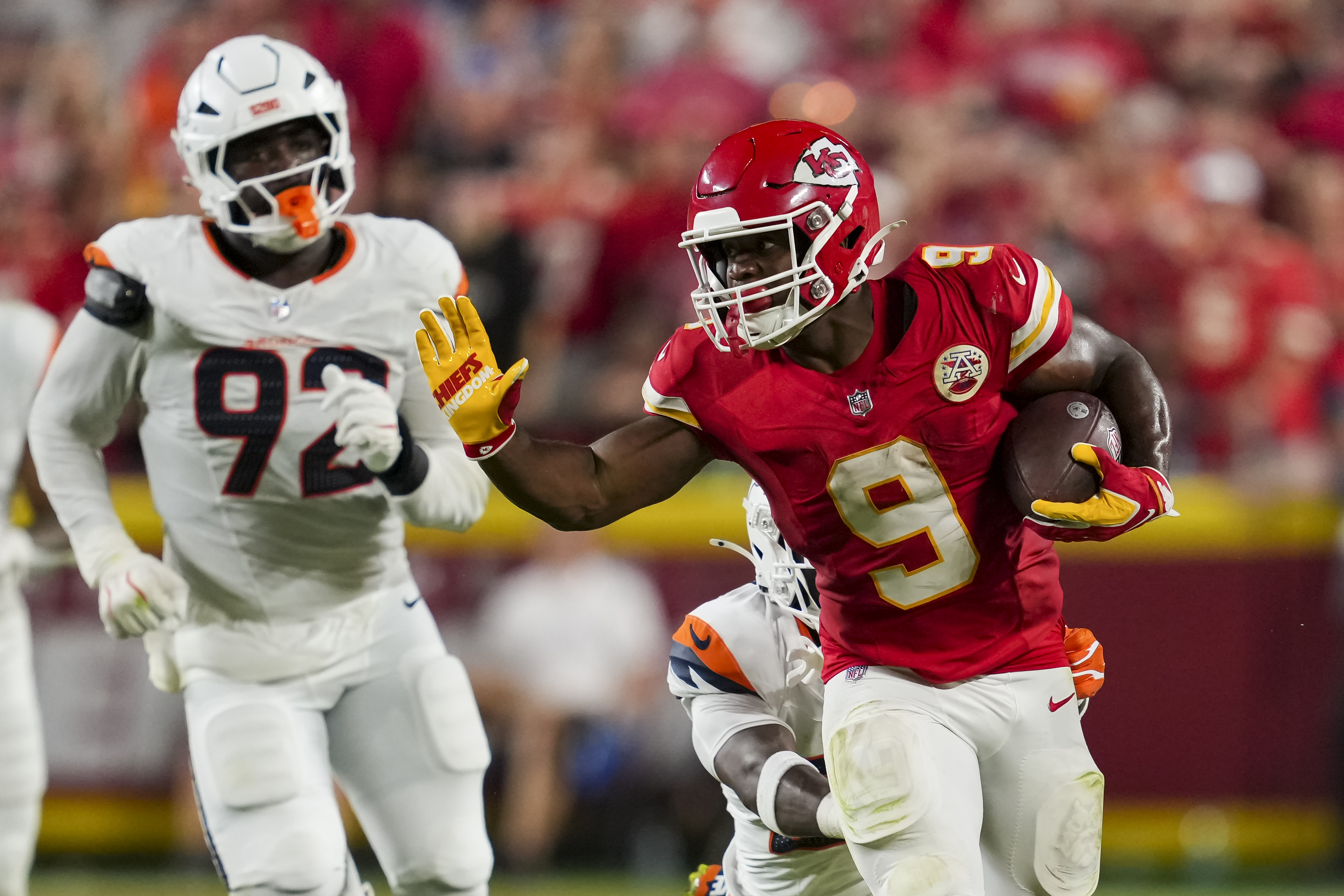 Kansas City Chiefs running back Kenneth Walker III (9) runs the ball against the Broncos as we offer our Chiefs vs. Broncos prediction.