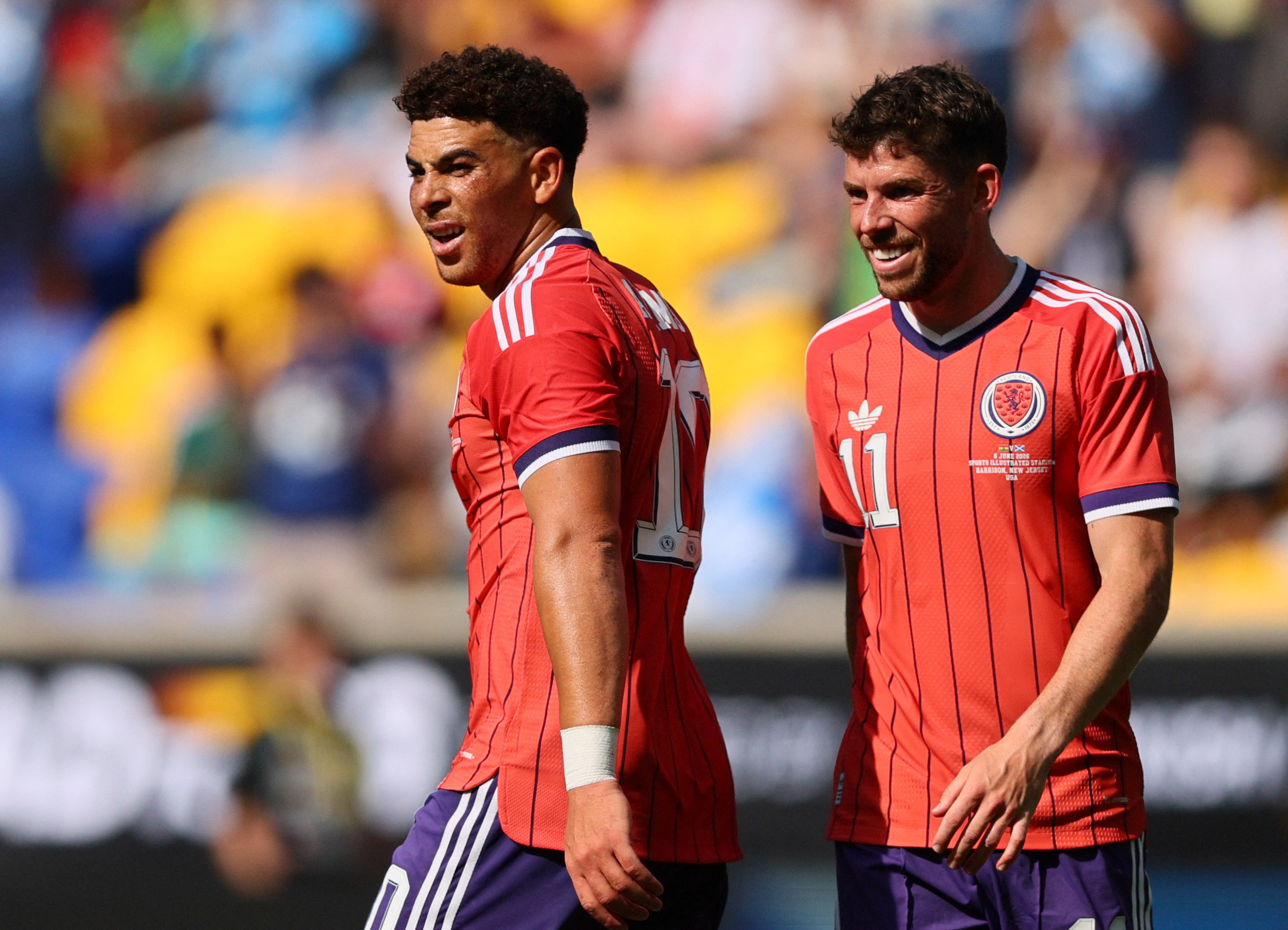 Scotland's Che Adams celebrates scoring their fourth goal as he is featured in our World Cup predictions.