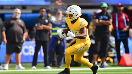 Kimani Vidal runs the ball for the Los Angeles Chargers, as we break down our Vikings vs. Chargers odds and predictions.