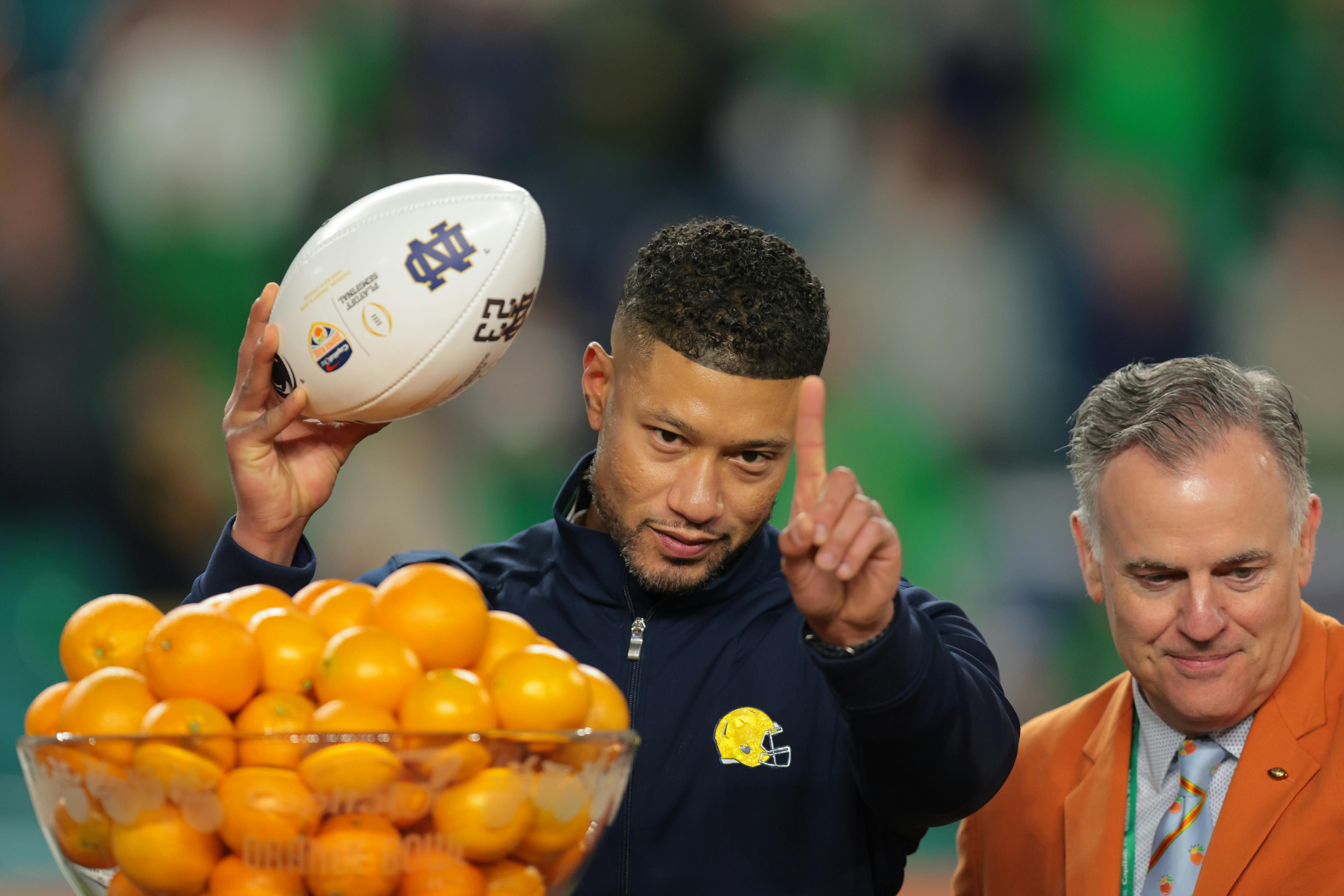 Notre Dame Fighting Irish head coach Marcus Freeman celebrates defeating the Penn State Nittany Lions in the Orange Bowl as we offer our Notre Dame football preview.