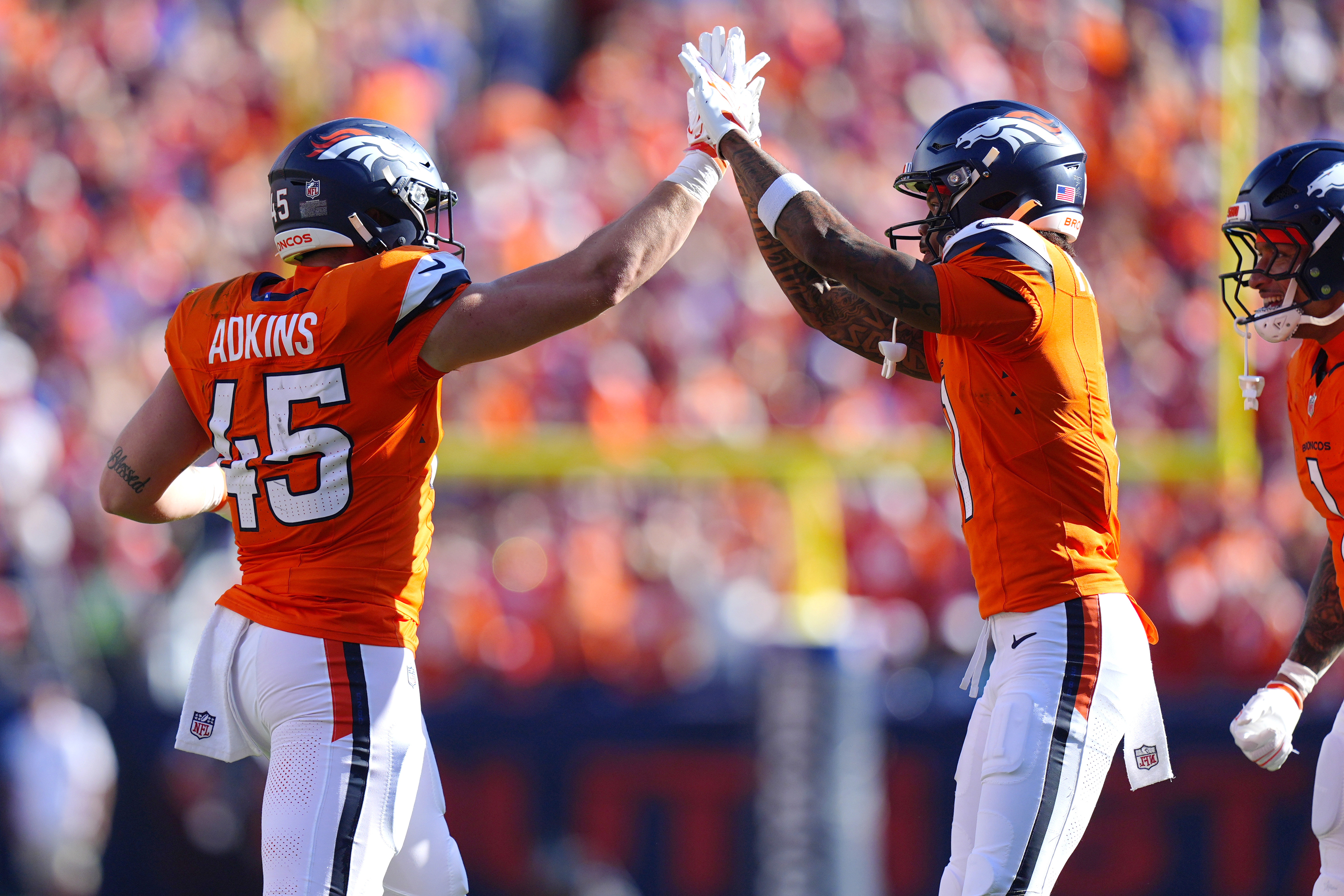 Denver Broncos tight end Nate Adkins celebrates a touchdown as we make our early Rams vs. Broncos prediction for SNF in Week 3