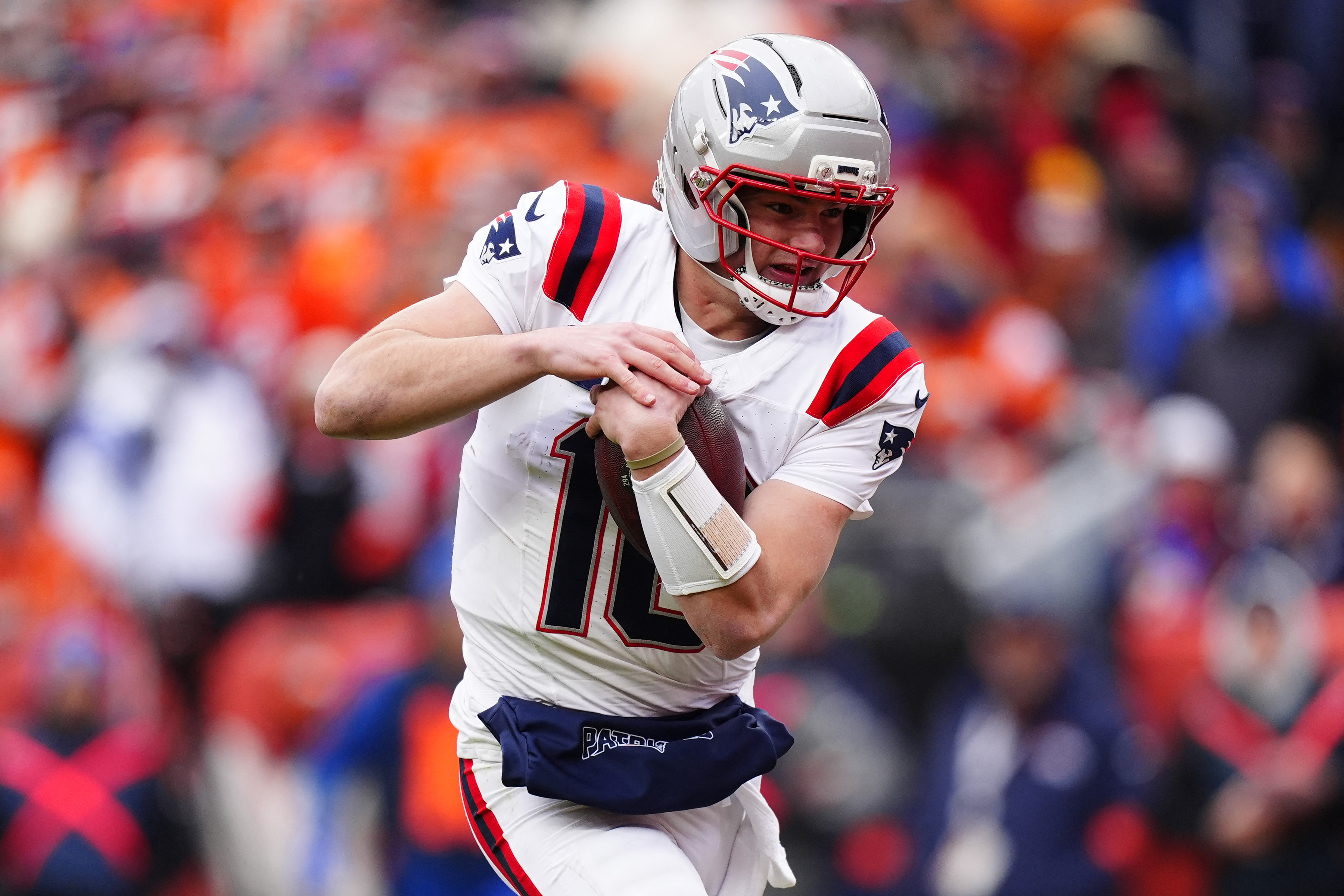 New England Patriots quarterback Drake Maye rushes as we look at the NFL asking the CFTC to regulate prediction market apps related to the league's integrity