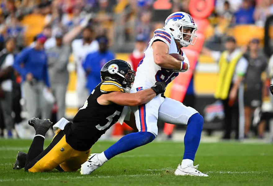Dalton Kincaid #86 of the Buffalo Bills is tackled by Cole Holcomb #55 of the Pittsburgh Steelers as we make our Steelers vs. Bills NFL player props picks and predictions ahead of Monday's playoff matchup on NFL Wild Card Weekend.