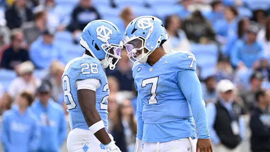 North Carolina Tar Heels running back Benjamin Hall with quarterback Gio Lopez as we look at our best North Carolina vs. Syracuse prediction
