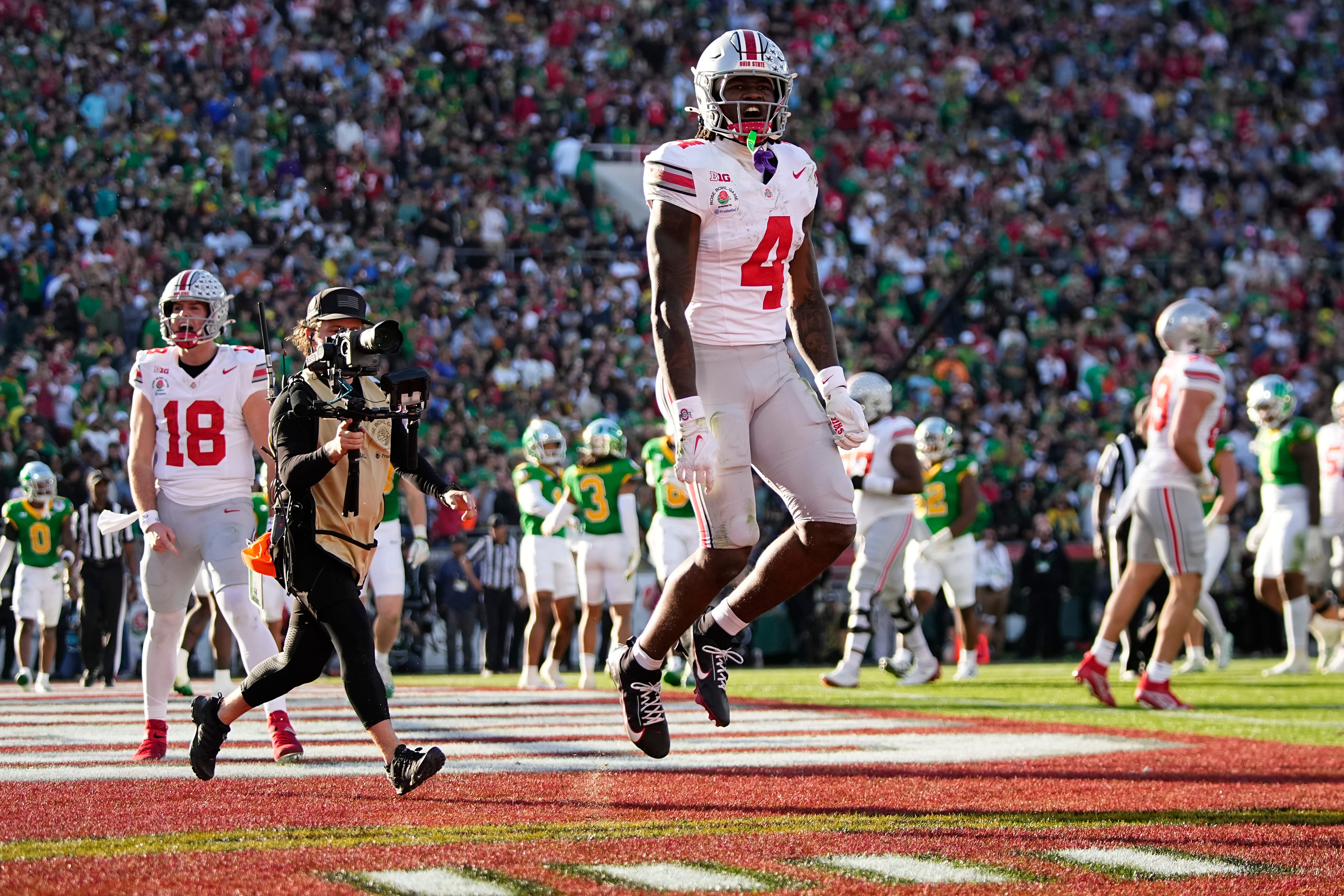 Ohio State wide receiver Jeremiah Smith celebrates a touchdown against Oregon. We're backing Smith in our Ohio State vs. Notre Dame prediction for the CFP National Championship. 