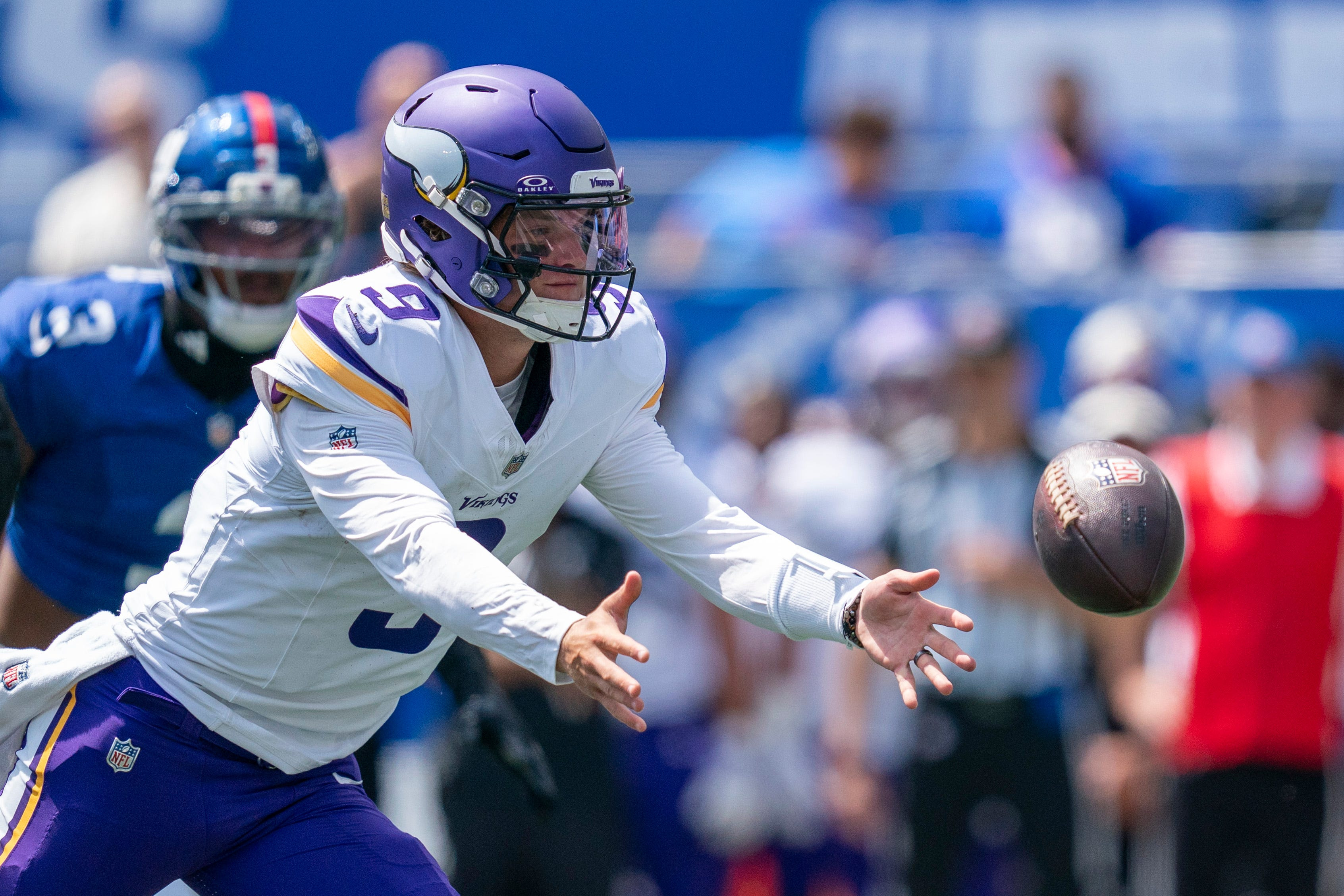 Minnesota Vikings quarterback J.J. McCarthy tosses the ball to a teammate as we make our best Ravens vs. Vikings prediction