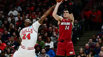 Tyler Herro of the Miami Heat shoots a three point basket in the first half against the Chicago Bulls at United Center. We're backing Herro in our Bulls vs. Heat player props & odds. 