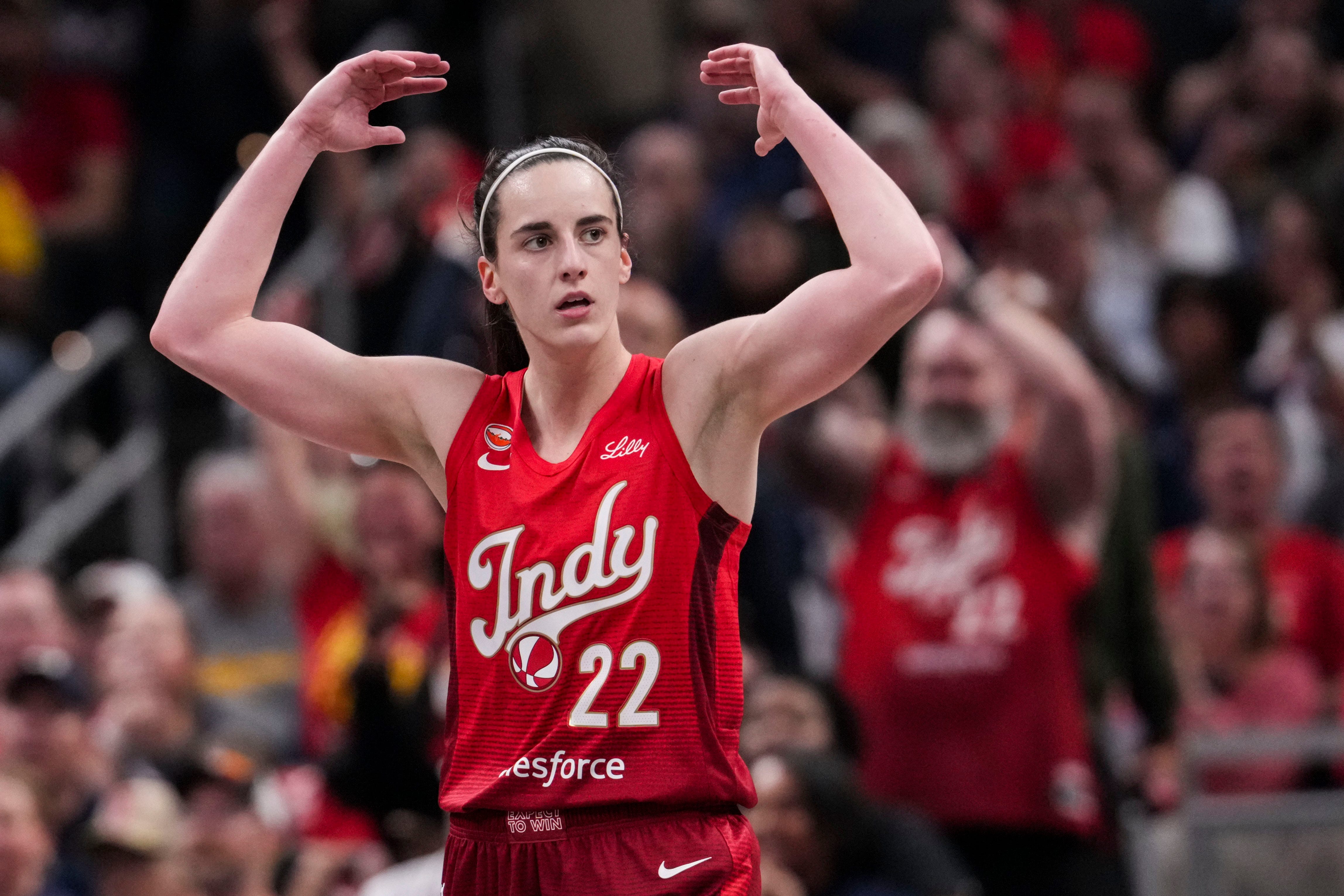 Indiana Fever guard Caitlin Clark (22) gets the crowd excited as she is featured in our Fever vs. Sparks prediction.