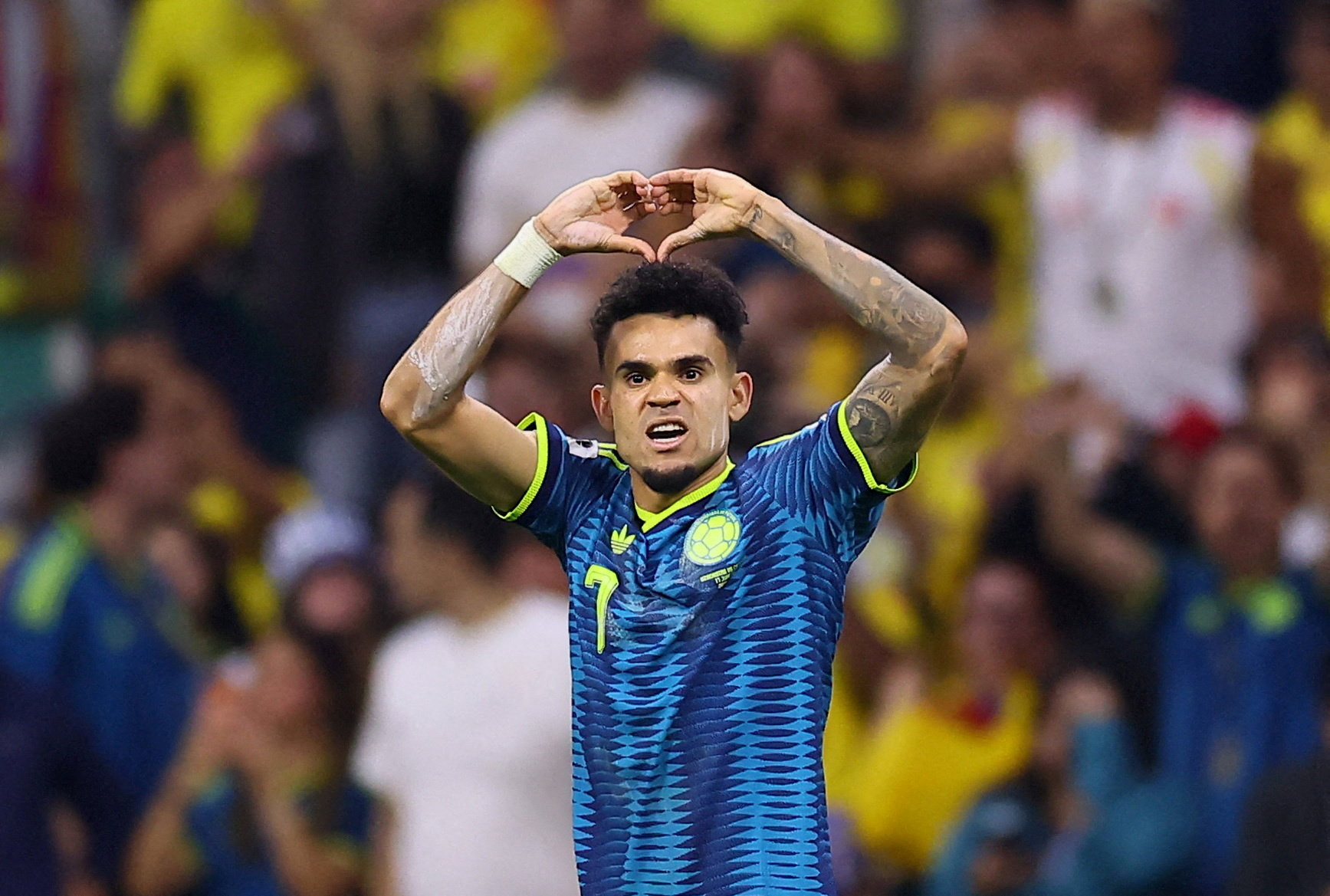 Colombia's Luis Diaz celebrates scoring as we make our best World Cup predictions today. 