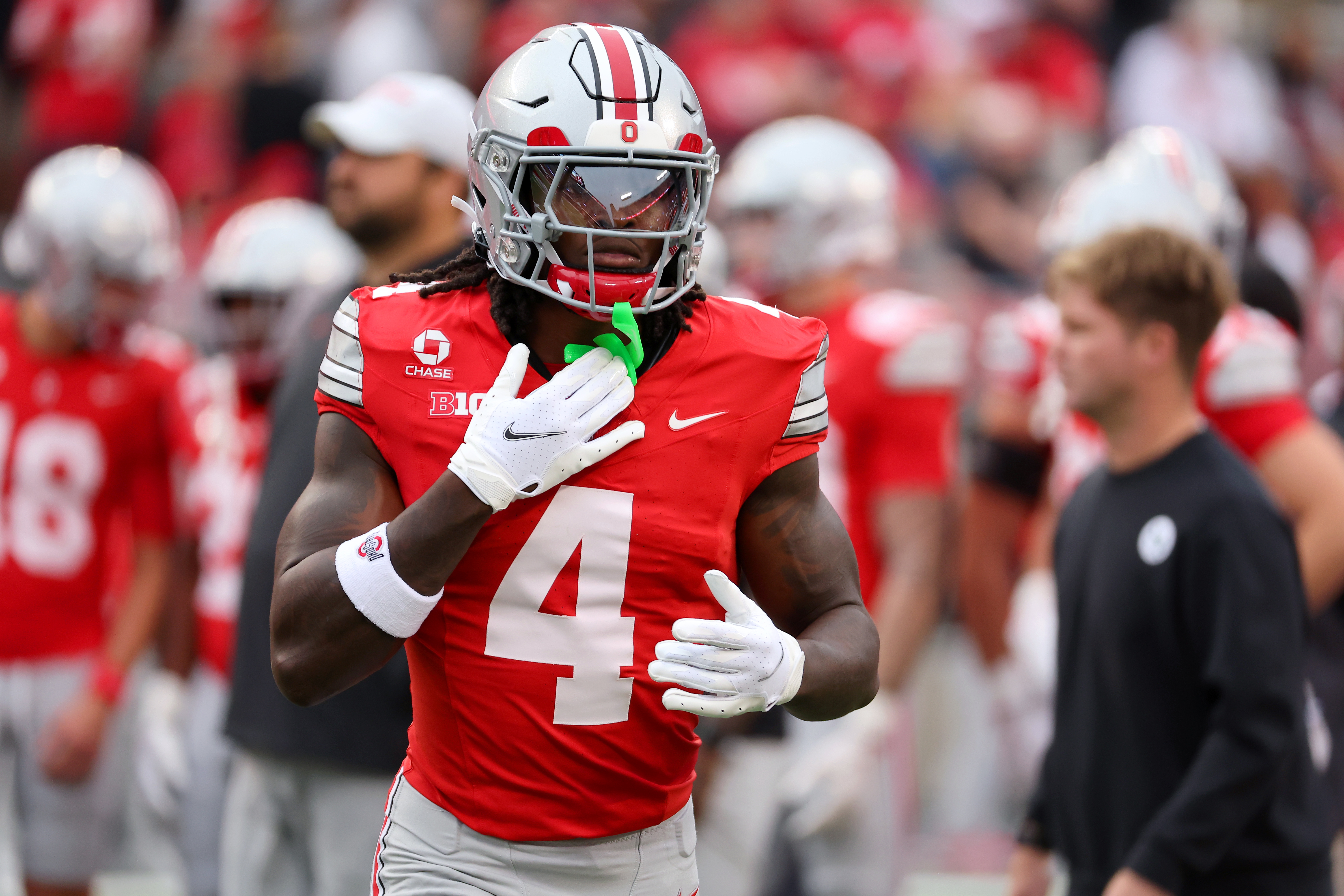 Ohio State Buckeyes wide receiver Jeremiah Smith (4) enters the field as we take a closer look at the 2026 Heisman odds.