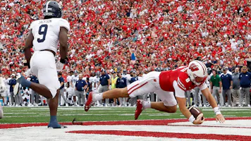 Tanner Mordecai of the Wisconsin Badgers scores a 1-yard touchdown run as we share our favorite Wisconsin vs. Purdue prediction. 