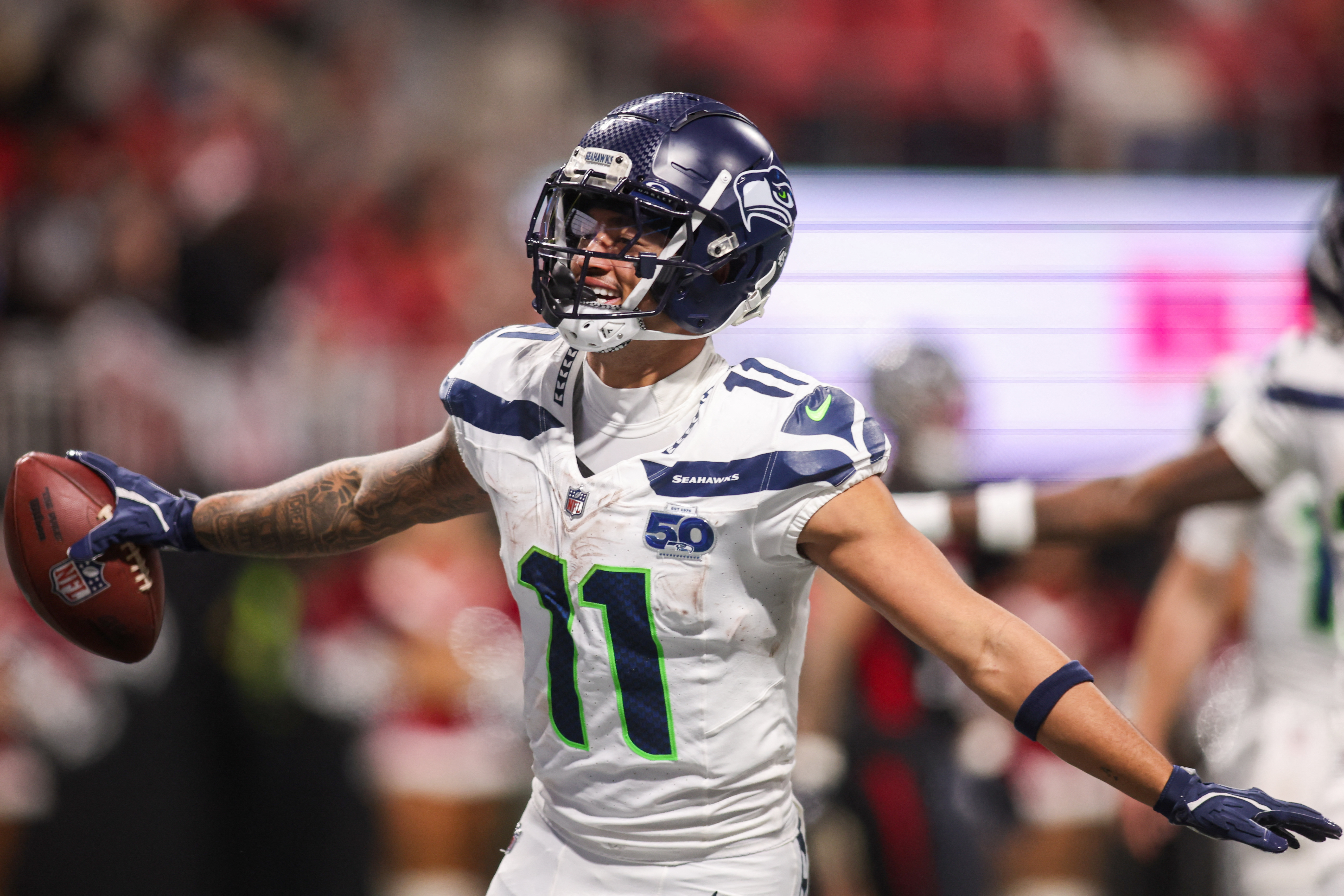 Seattle Seahawks wide receiver Jaxon Smith-Njigba (11) celebrates after a touchdown as we break down the Super Bowl records.