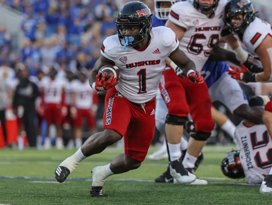 Antario Brown #1 of the Northern Illinois Huskies runs the ball as we make our Arkansas State vs. Northern Illinois prediction and pick for the Camellia Bowl on Saturday.