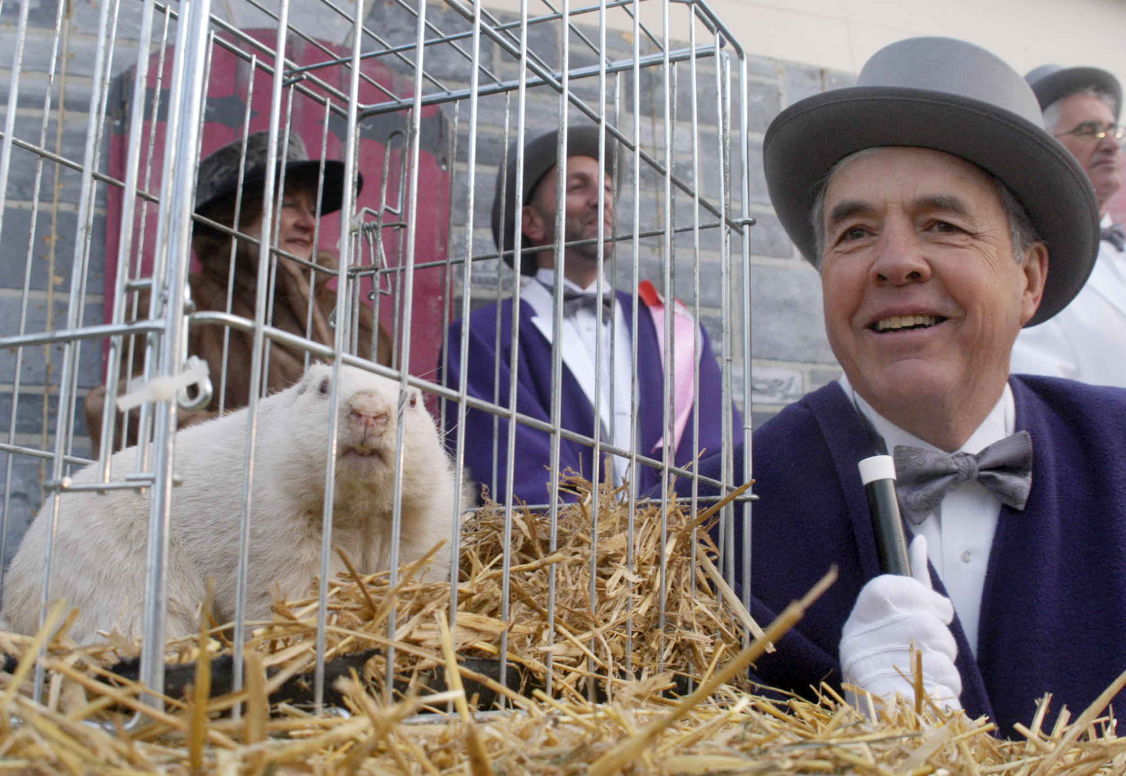 Former South Bruce Peninsula Mayor Carl Noble and Wiarton Willie take part in the annual Groundhog Day ceremony in Wiarton, Ontario.