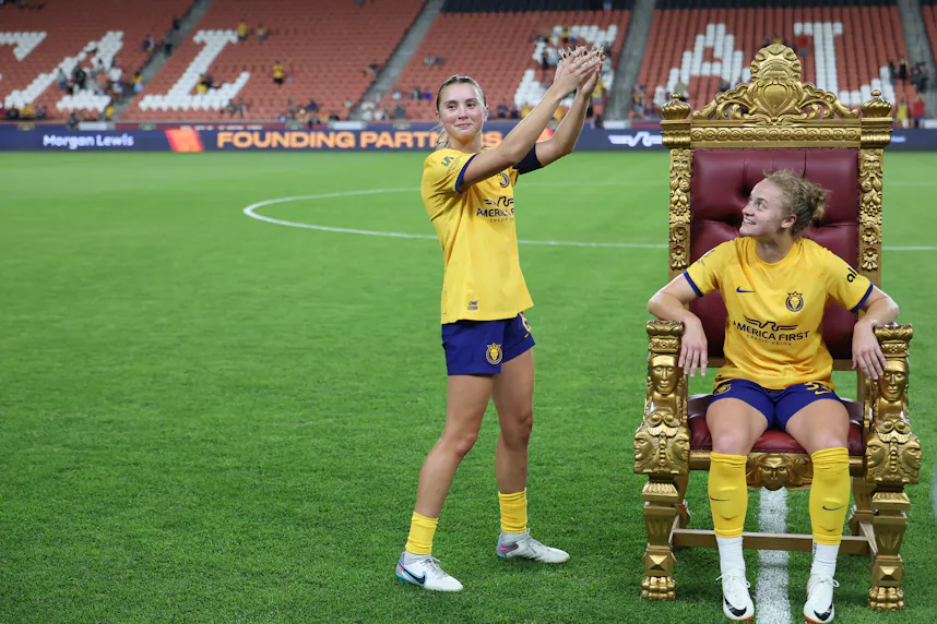 Utah Royals FC defender Kate Del Fava presents a crown to forward Hannah Betfort as we look at Utah's upcoming efforts to legalize a lottery.