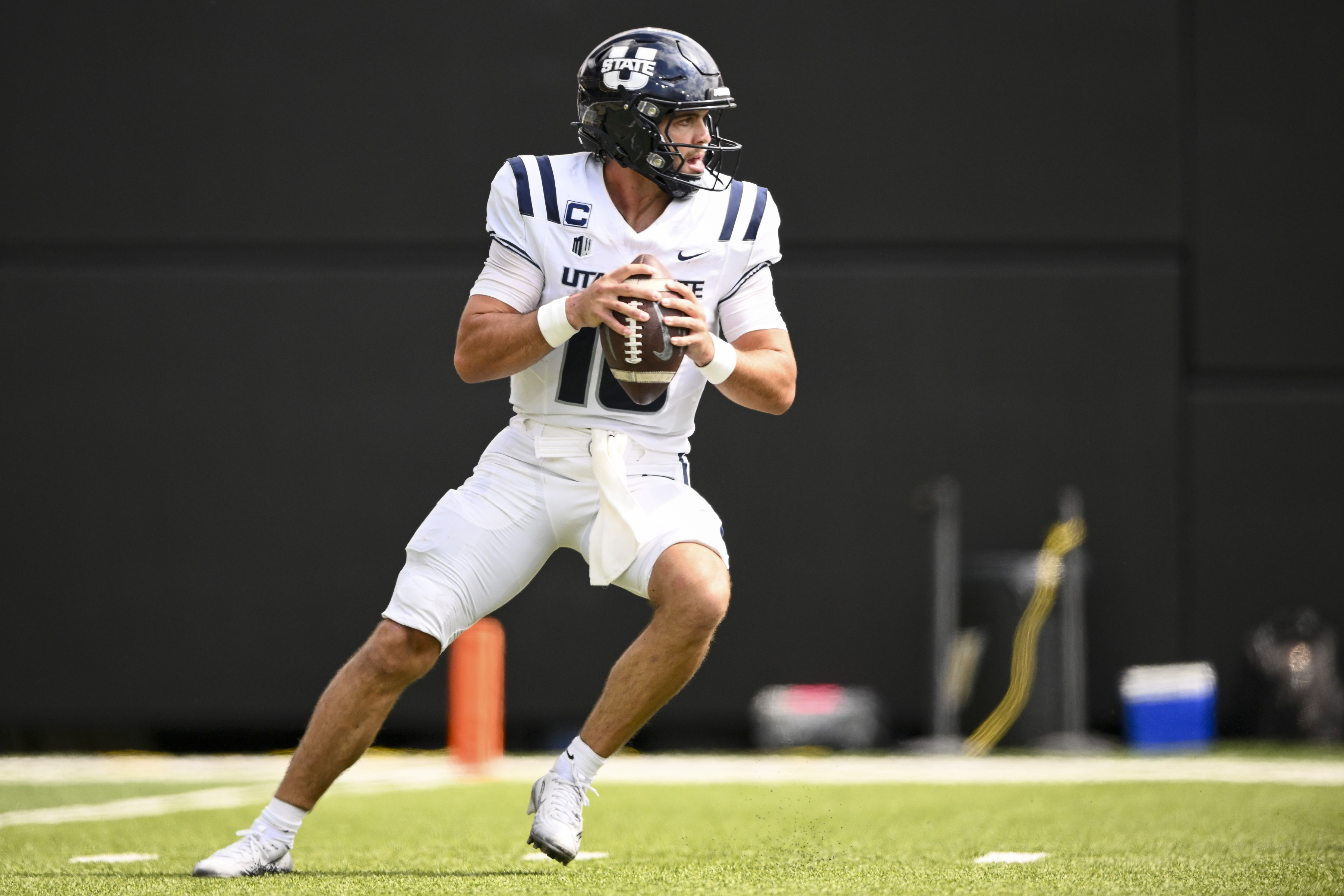 Utah State quarterback Bryson Barnes (16) stands in the pocket as we offer our Washington State vs. Utah State player props.