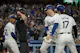 Los Angeles Dodgers first baseman Freddie Freeman is greeted at the plate by shortstop Mookie Betts and designated hitter Shohei Ohtani after hitting a grand slam, and the Dodgers remain the favorites by the latest World Series odds.