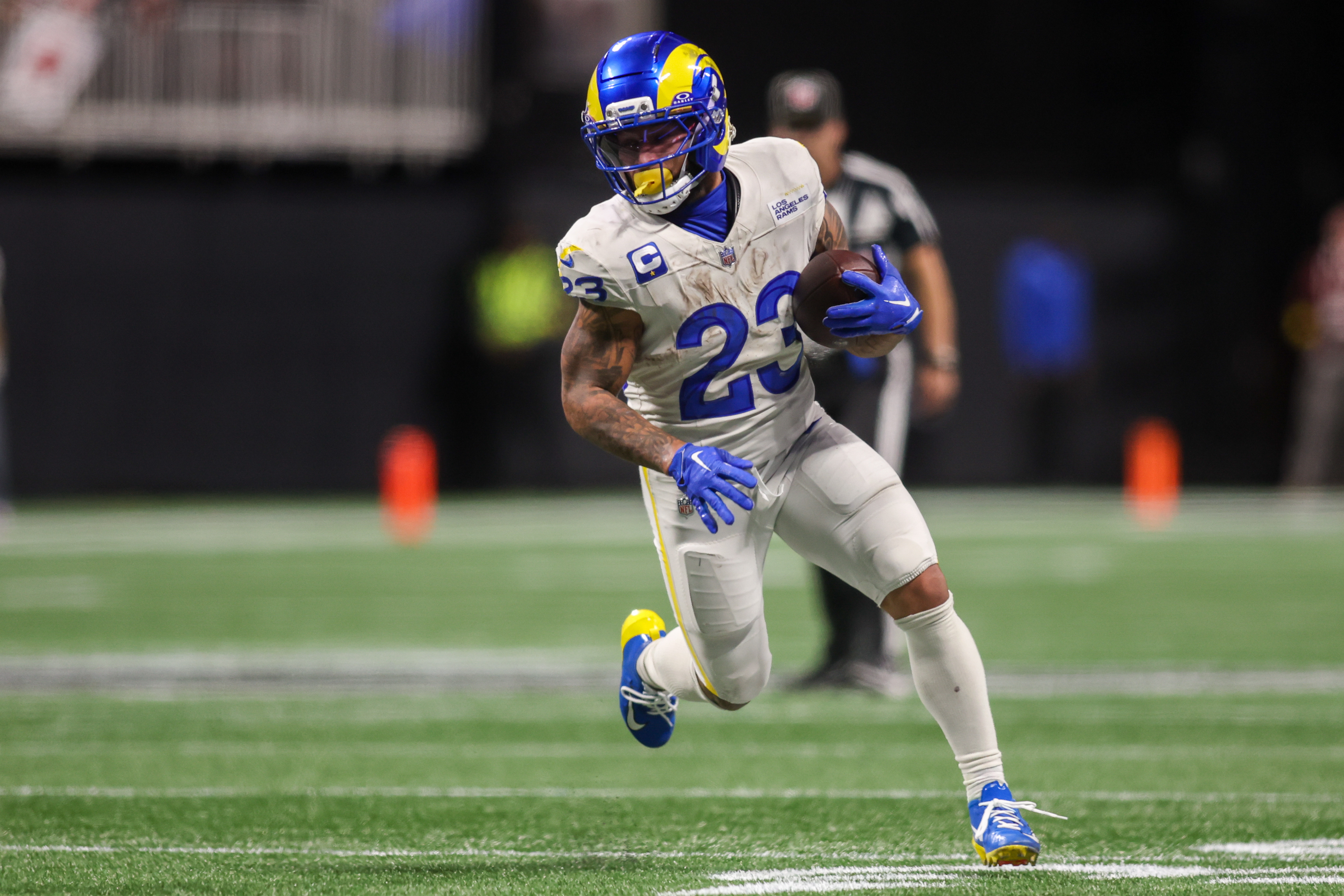 Los Angeles Rams running back Kyren Williams (23) runs the ball as we break down our Rams vs. Panthers prediction.