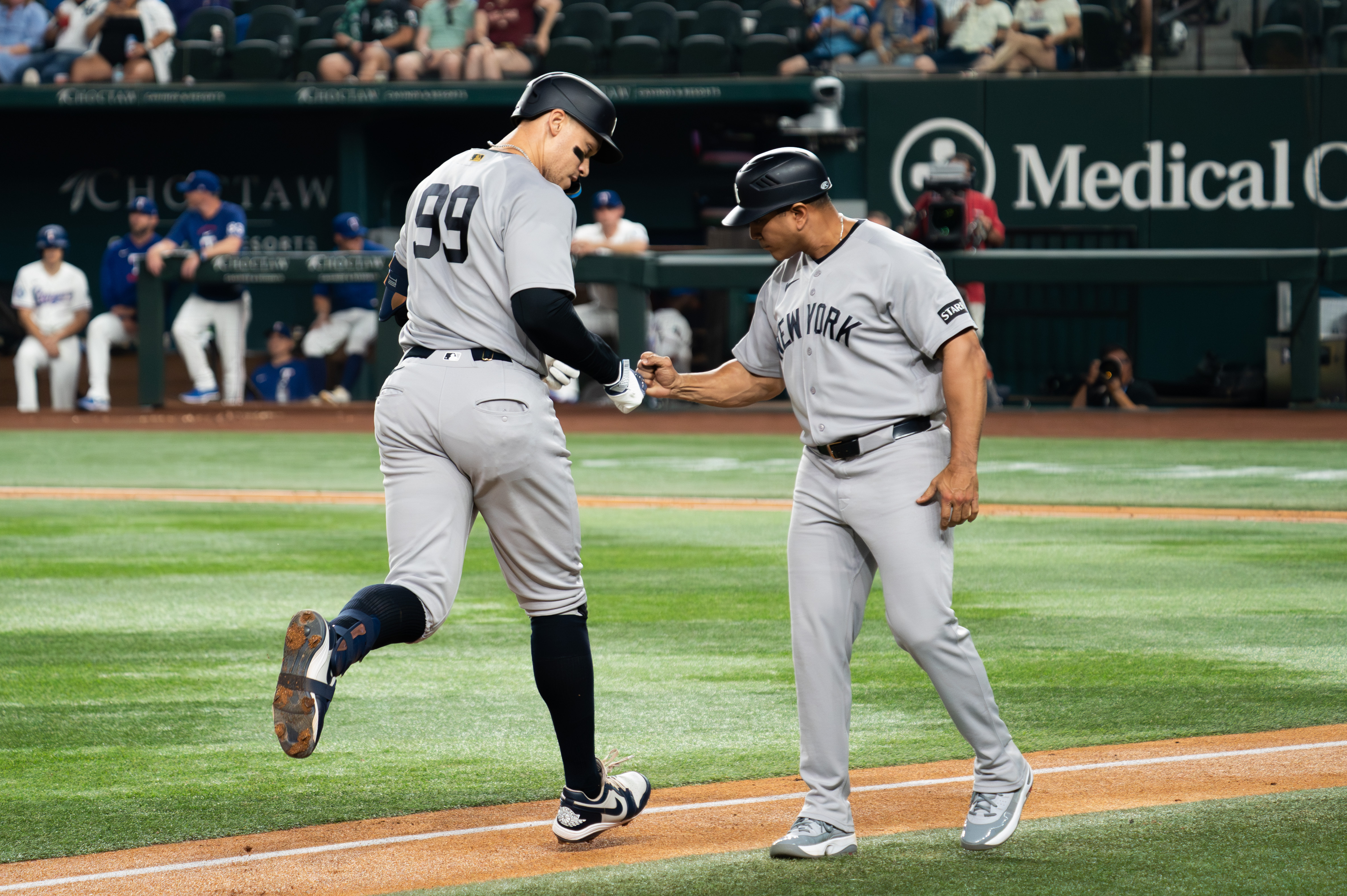 New York Yankees right fielder Aaron Judge (99) fist bumps third base coach Luis Rojas (67) as we break down our MLB Play of the Day.