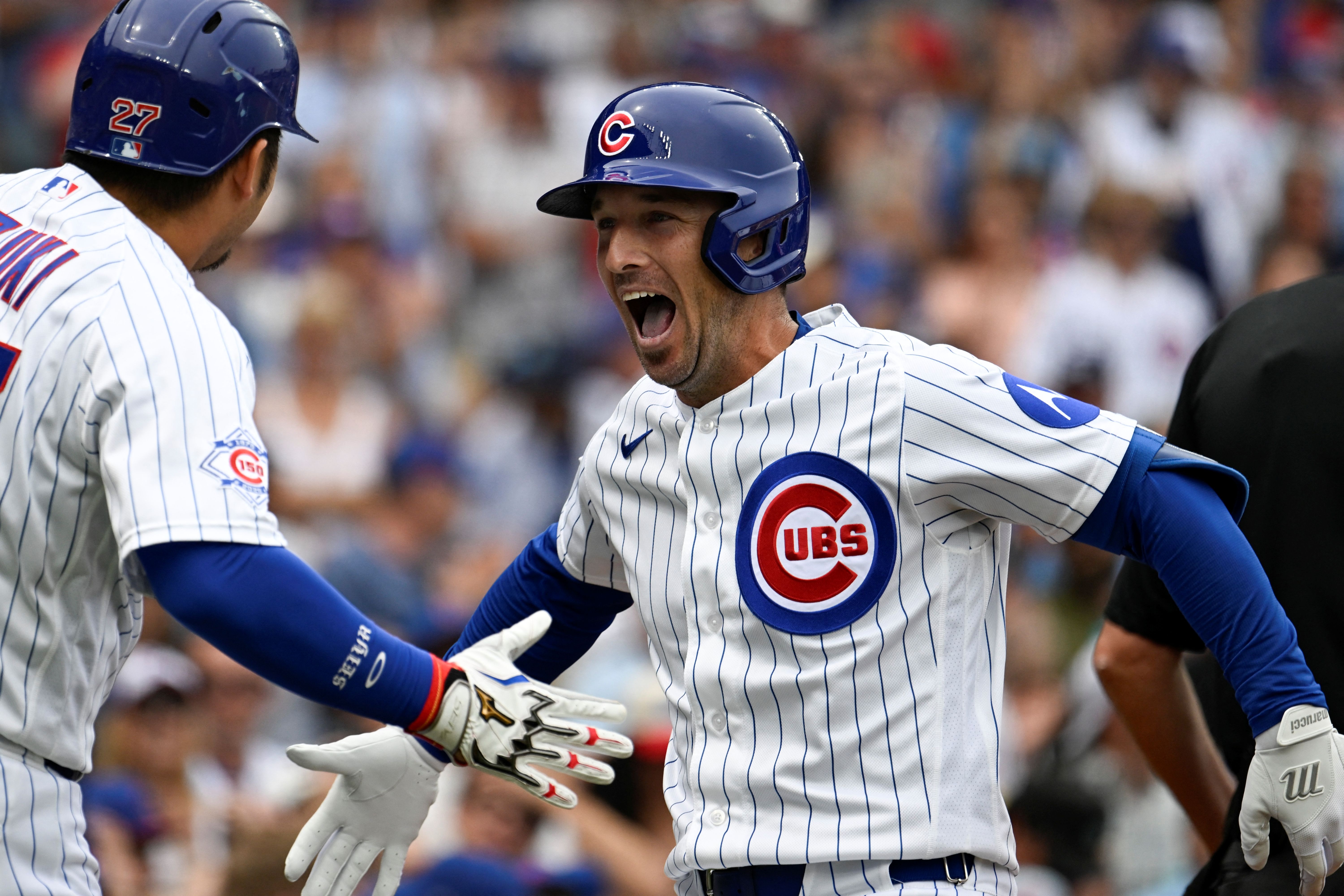 Chicago Cubs third baseman Alex Bregman (3) and right fielder Seiya Suzuki (27) react as we break down our Brewers vs. Cubs win probability.