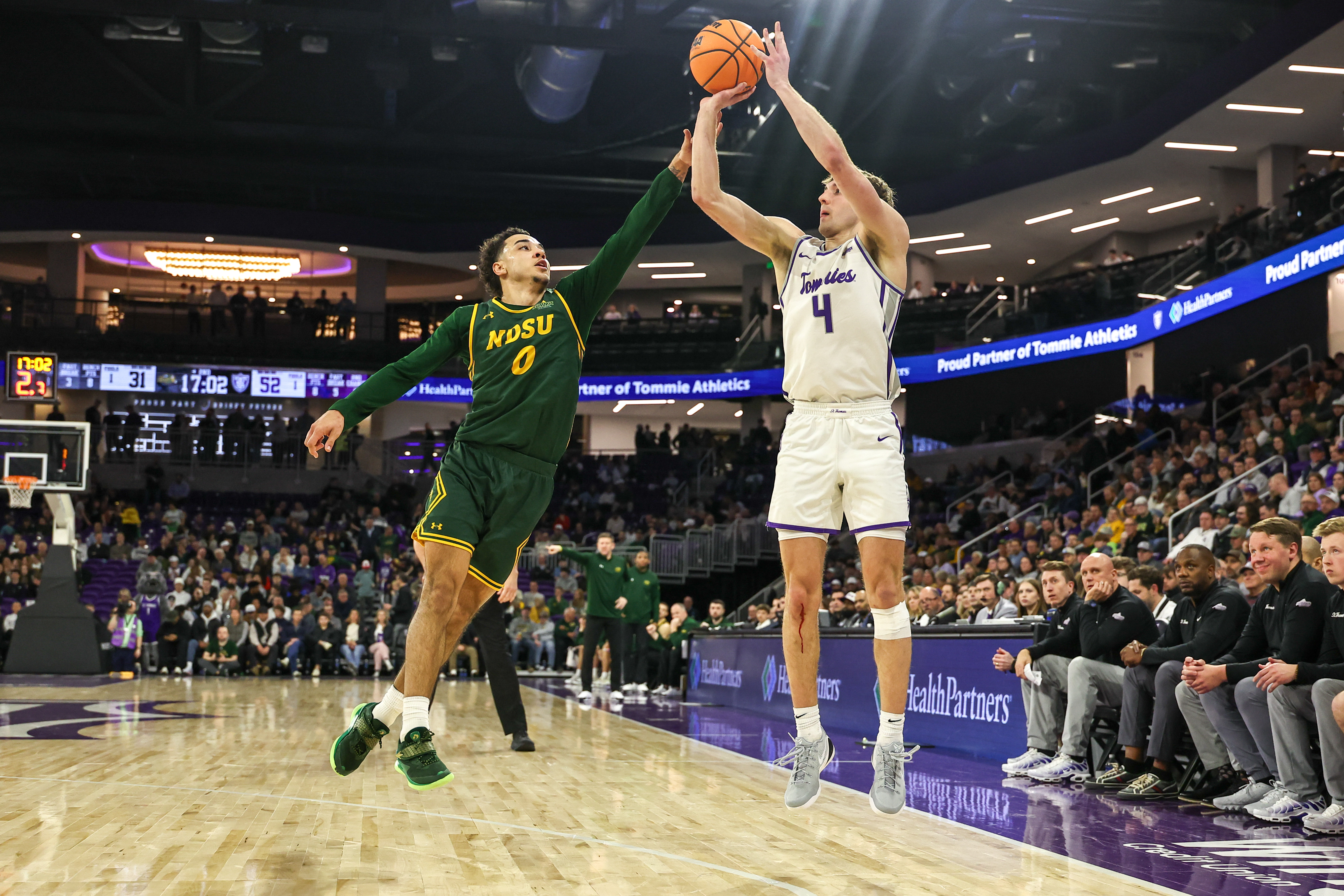 St. Thomas' Nolan Minessale (4) has the Tommies atop the Summit League Tournament odds, one of 31 tournaments highlighted in our college basketball conference tournament guide. 