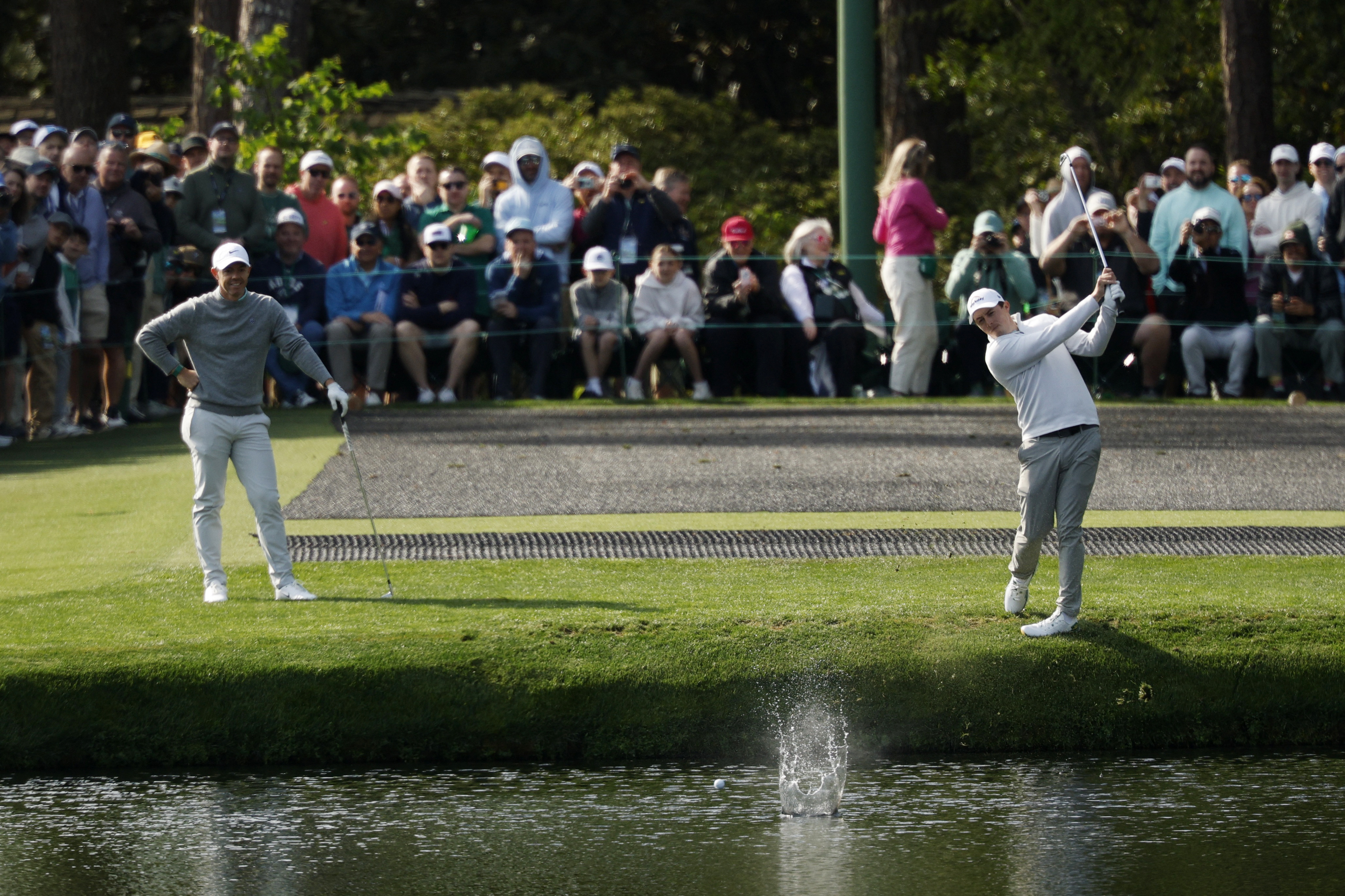 England's Matt Fitzpatrick skips the ball across the water on the 16th hole during a practice round at Augusta National.