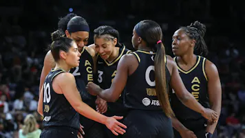 Kelsey Plum, A'ja Wilson, Candace Parker, Jackie Young, and Chelsea Gray of the Las Vegas Aces huddle as we look at the best WNBA Championship odds