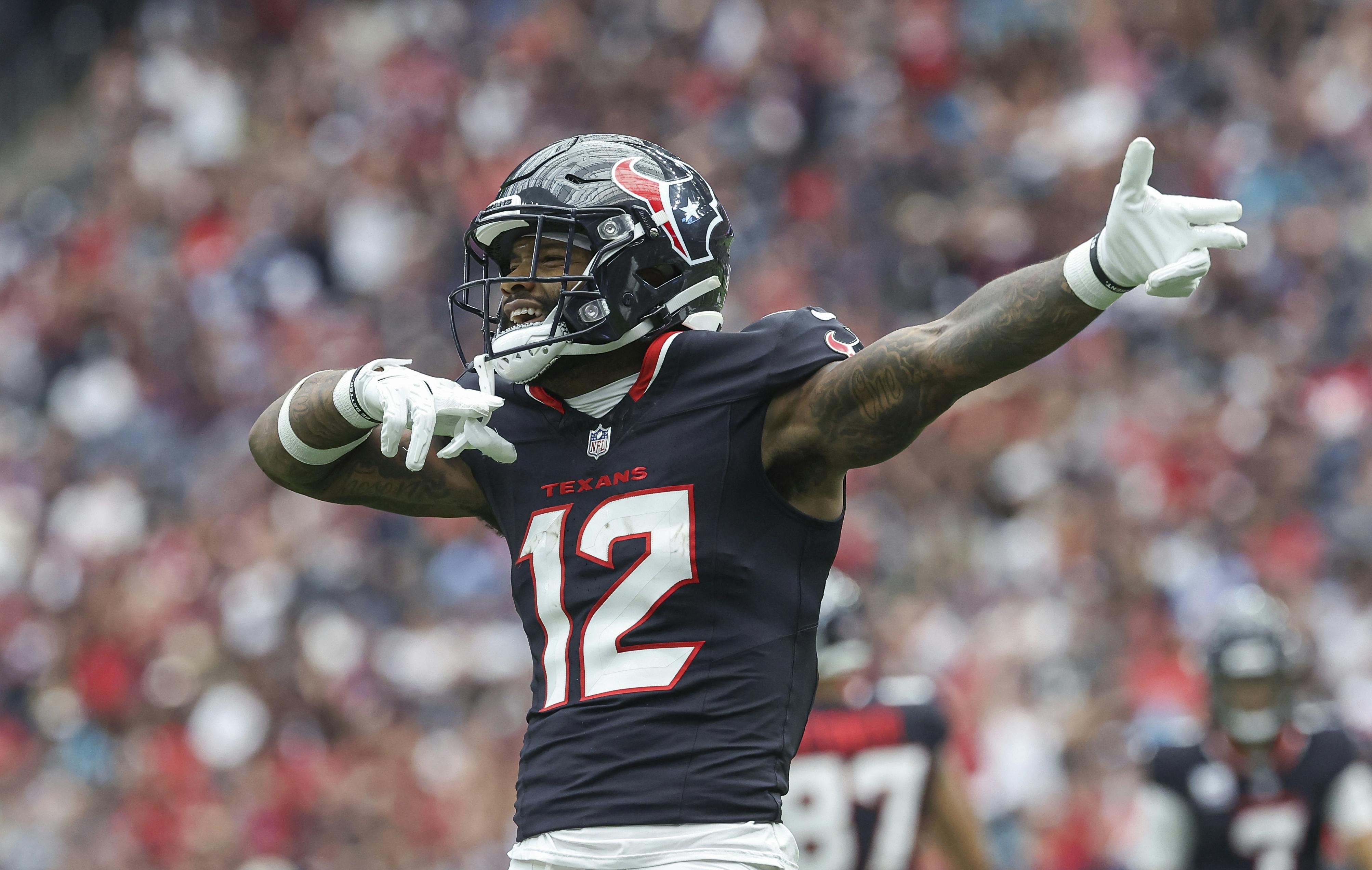 Houston Texans wide receiver Nico Collins (12) signals after a first down as we offer our NFL Week 12 odds and predictions.