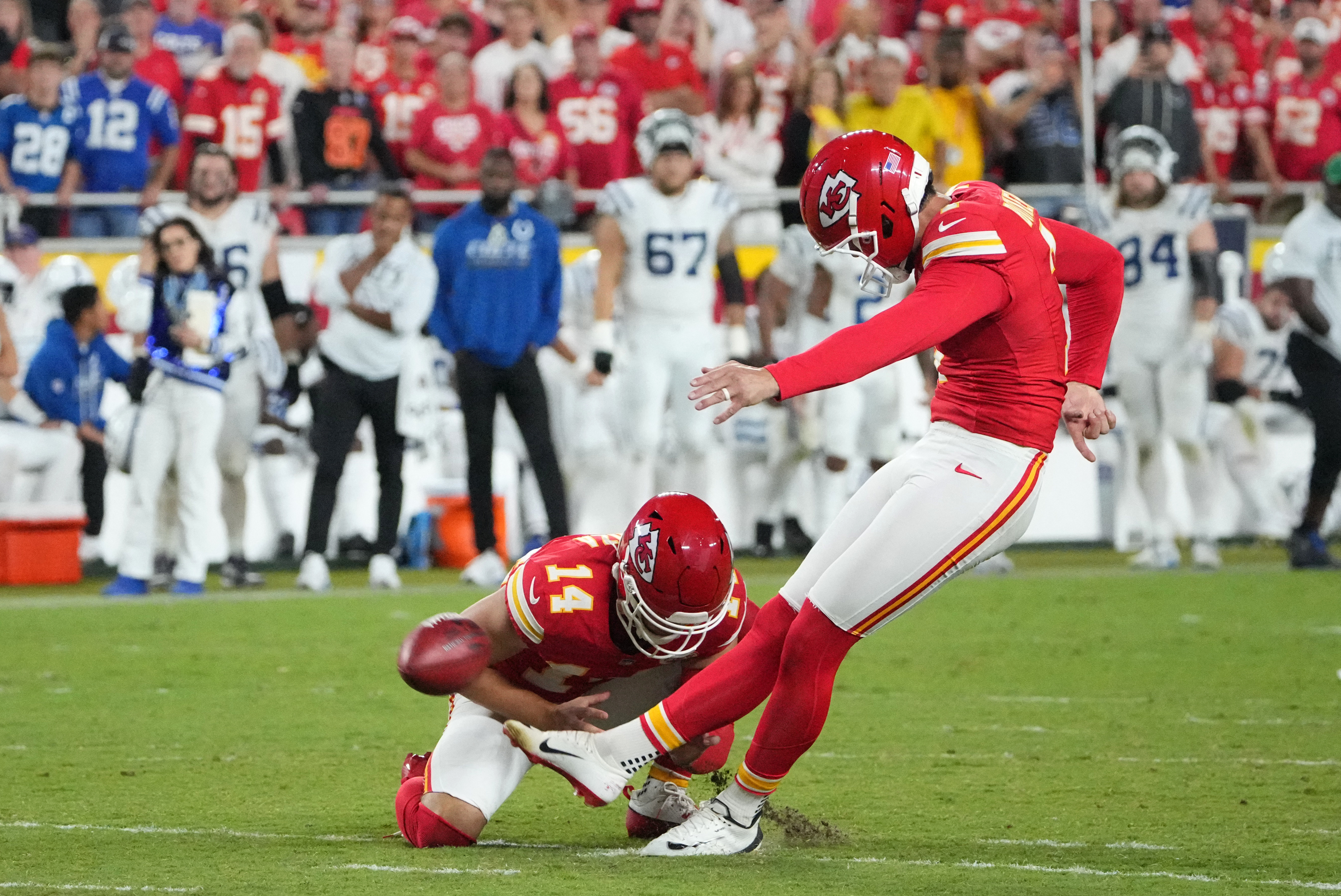 Kansas City Chiefs kicker Harrison Butker kicks a field goal as we look at prediction market trading volume at the start of the NFL season.