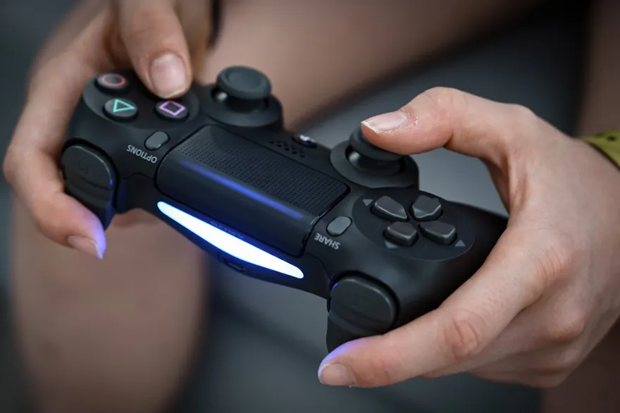 Detail of the gamepad of a person playing video games during a free summer Esport course for youth in Boulogne-Billancourt on July 22, 2020. Photo by Bertrand Guay via AFP.