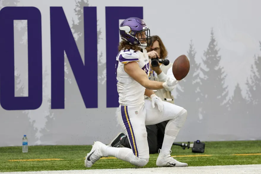 T.J. Hockenson of the Minnesota Vikings celebrates after scoring a receiving touchdown during the first quarter against the New York Giants at U.S. Bank Stadium on December 24, 2022 in Minneapolis, Minnesota.