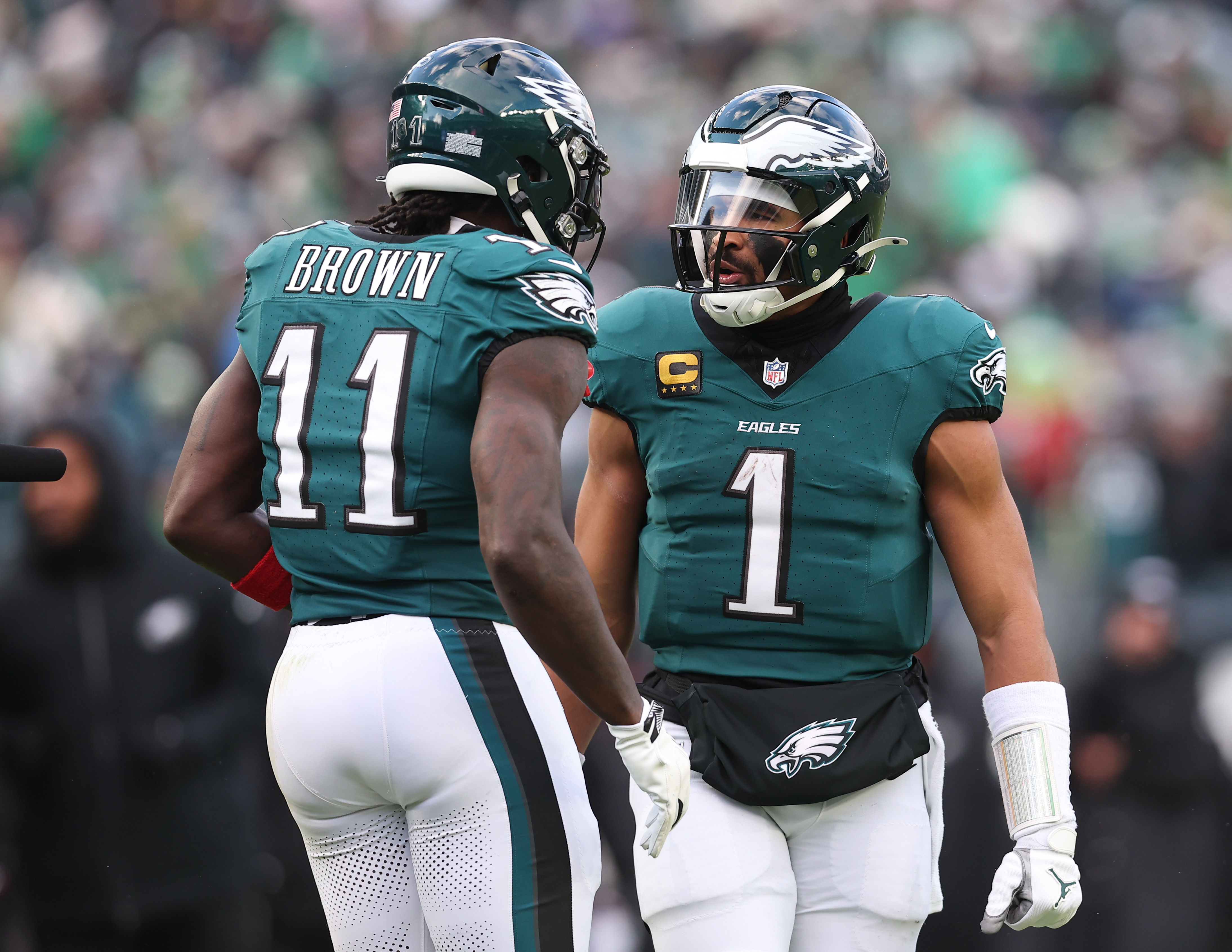 Philadelphia Eagles quarterback Jalen Hurts (1) reacts with wide receiver A.J. Brown (11) as part of our Eagles vs. Commanders prediction.