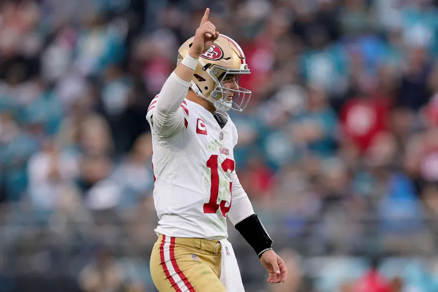 Brock Purdy of the San Francisco 49ers reacts after a touchdown as we share our best Ravens vs. 49ers prediction.